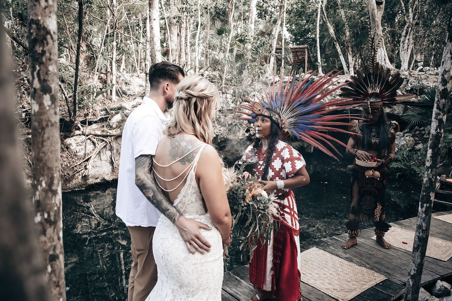 Mystical outdoor ceremony setup in a wooded area with traditional elements and decor.