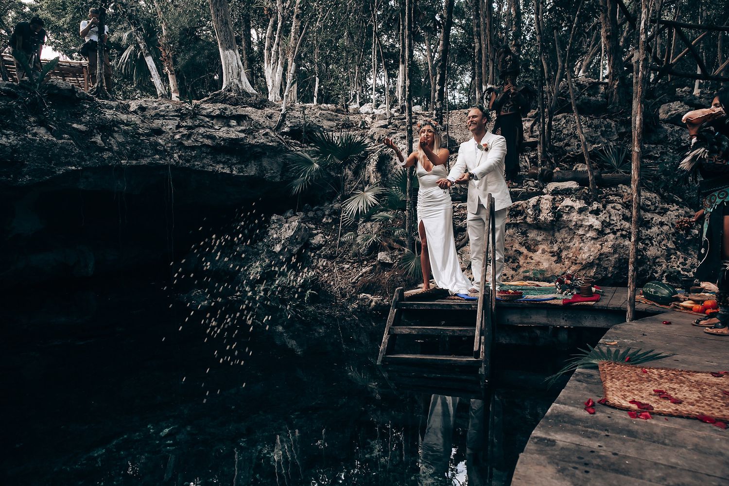 A romantic outdoor photoshoot in a moody forest setting with dramatic lighting and natural scenery.