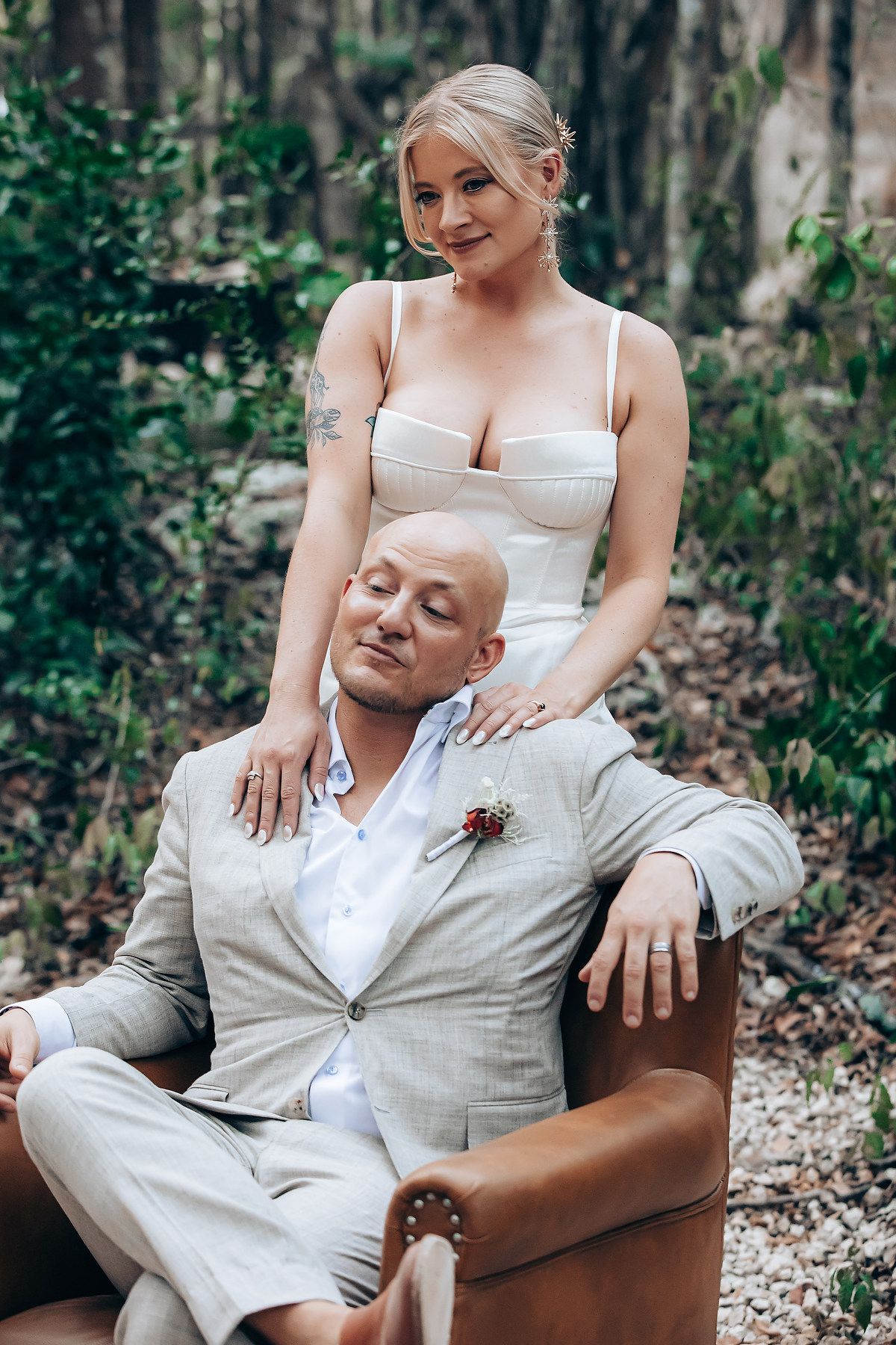 Romantic portrait session in a wooded setting with elegant wedding attire.