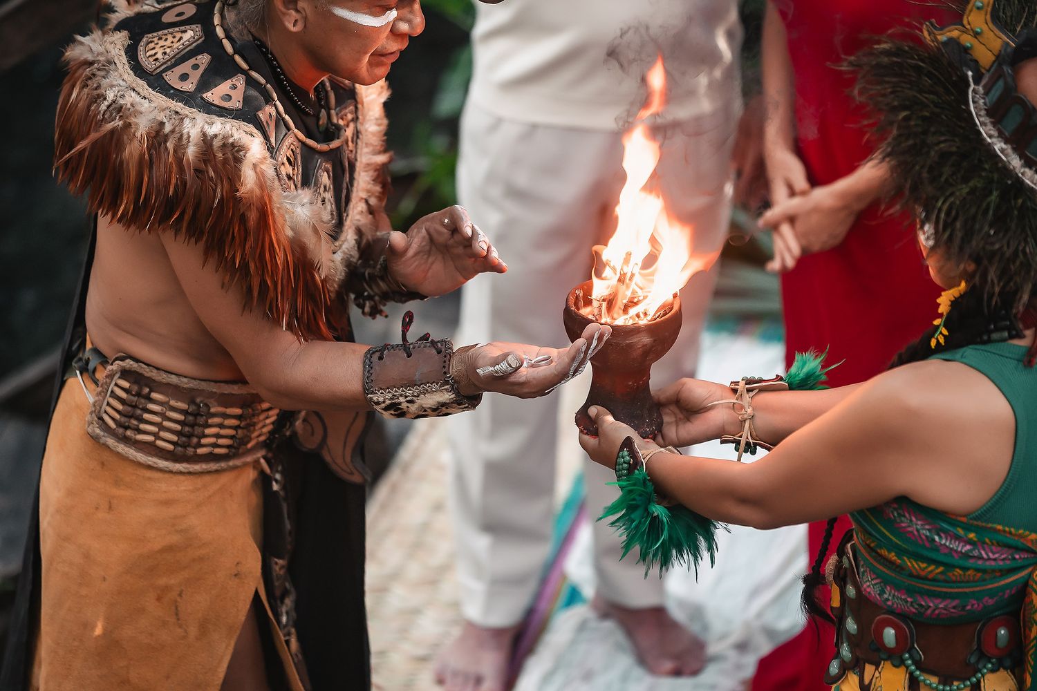 Sacred Mayan ritual with ceremonial fire and traditional dress in natural surroundings.
