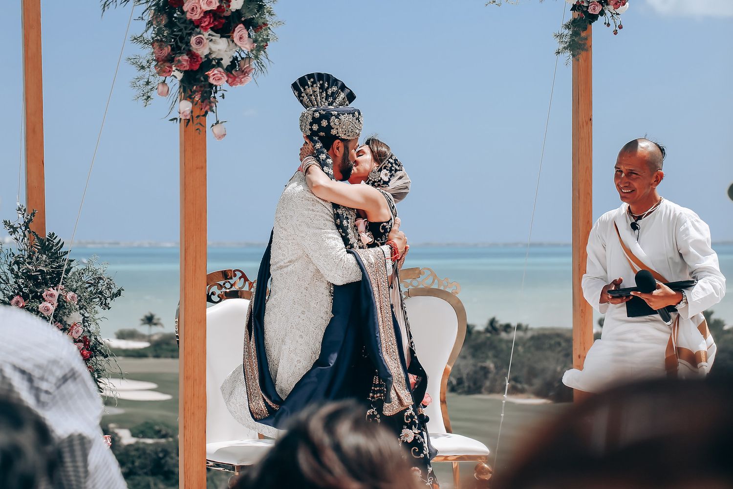 A romantic wedding photo collage showing couples embracing on a beach with floral decorations and ocean views.
