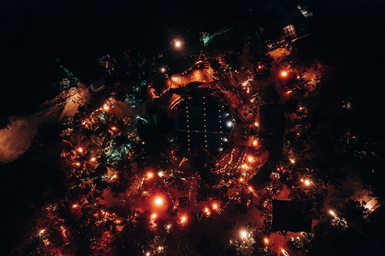Glowing string lights create a magical ambiance against a dark night sky.