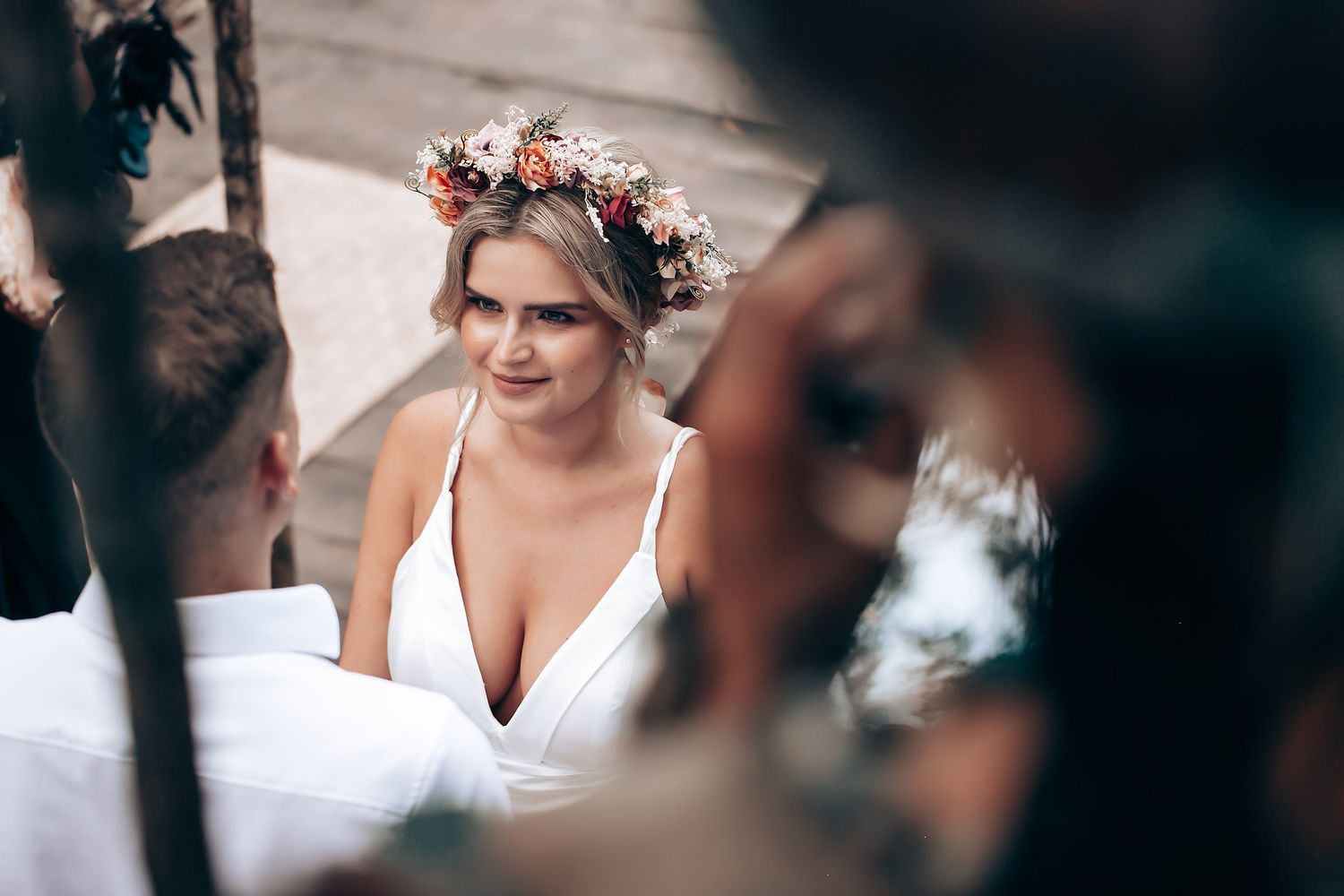 Wedding celebration in a natural outdoor setting with decorative elements.