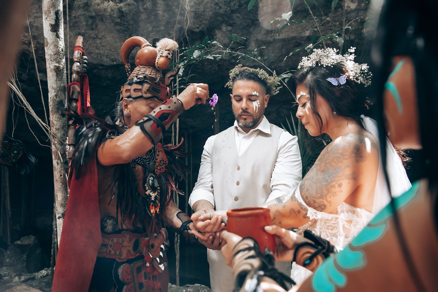 Candid moments captured during an outdoor forest celebration with traditional elements.