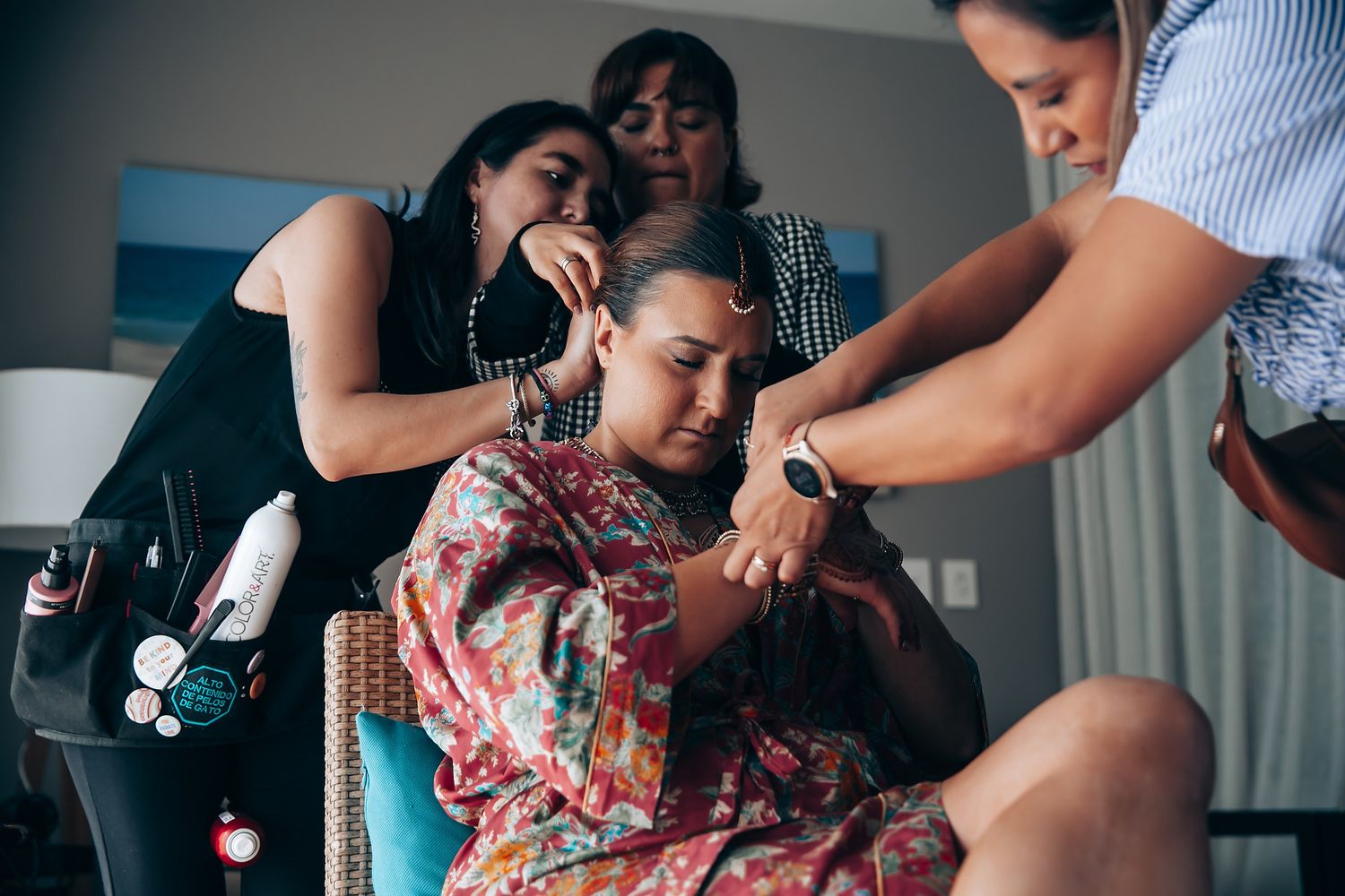 Wedding preparation moments captured in a series of candid photos showing traditional Indian dress.