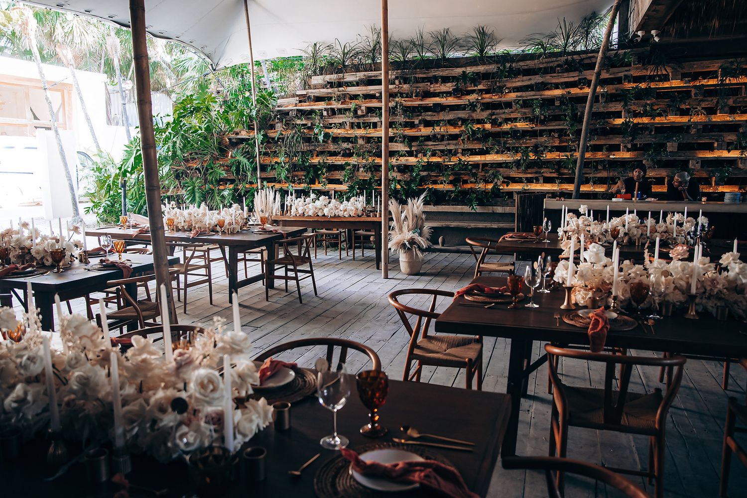 Panoramic view of a modern restaurant space with natural lighting and wooden furniture.