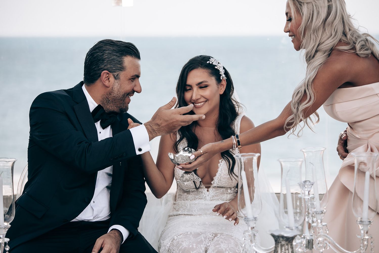 Wedding couple enjoying an intimate dining moment at an elegant reception.