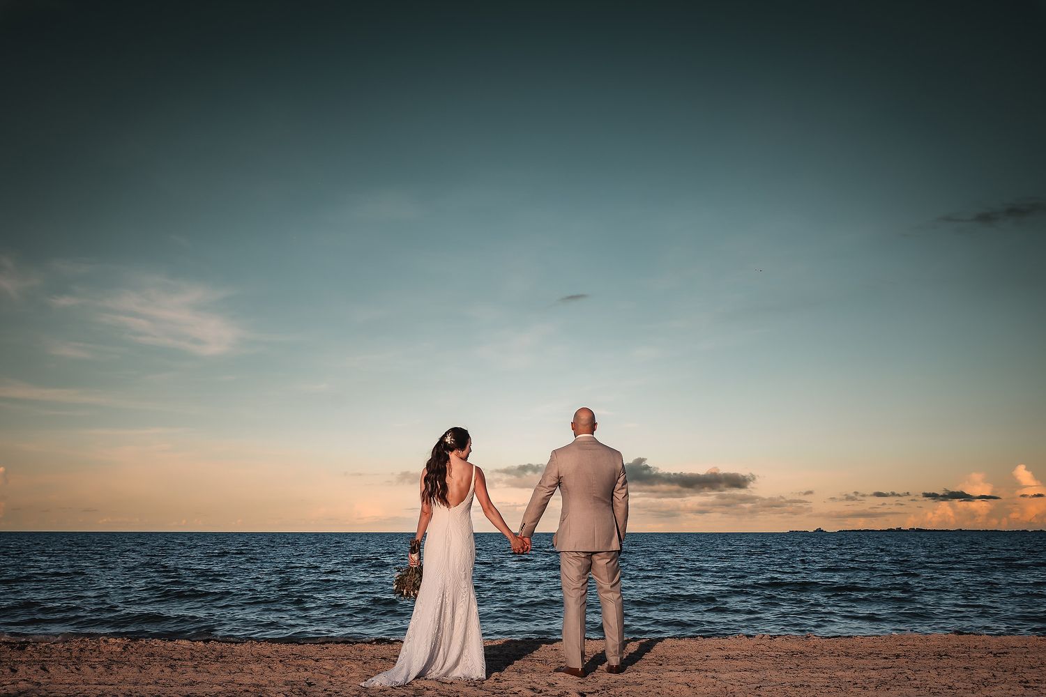 TRS Coral Costa Mujeres bride and groom portrait by the sea