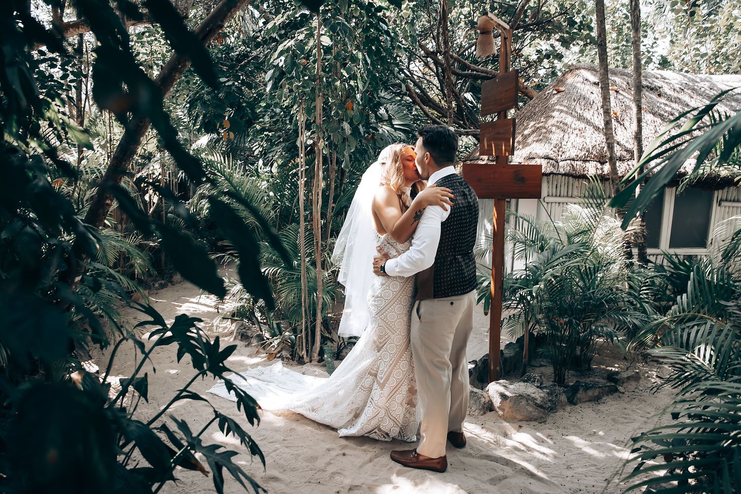 Romantic garden photoshoot with white attire and natural greenery surroundings.