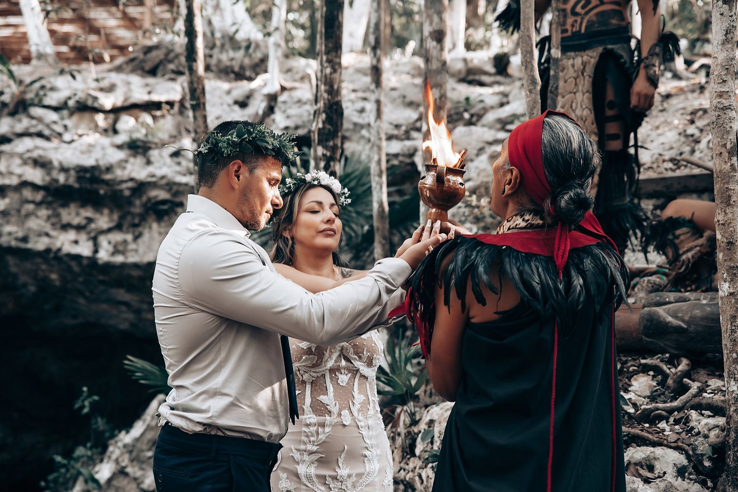 Wedding celebration in a rustic outdoor setting with stone walls and natural lighting.