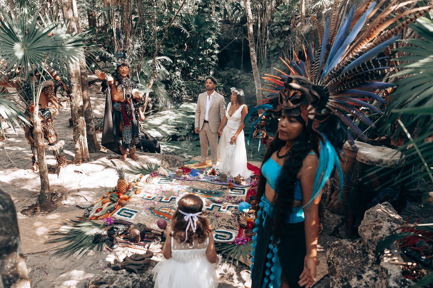 Outdoor ceremony participants gathered in a natural forest setting.