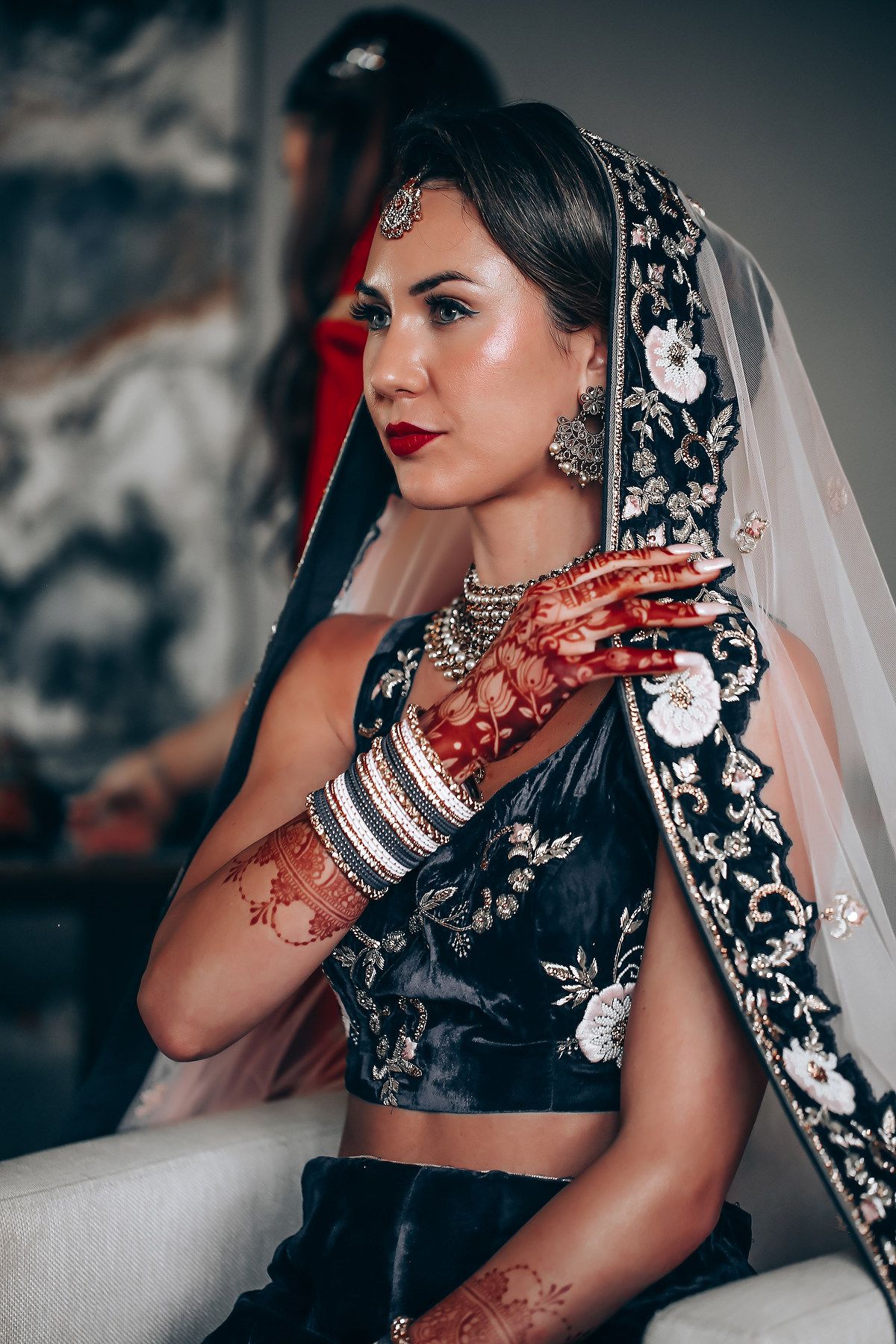A series of close-up shots showing traditional Indian bridal jewelry and henna decorated hands.