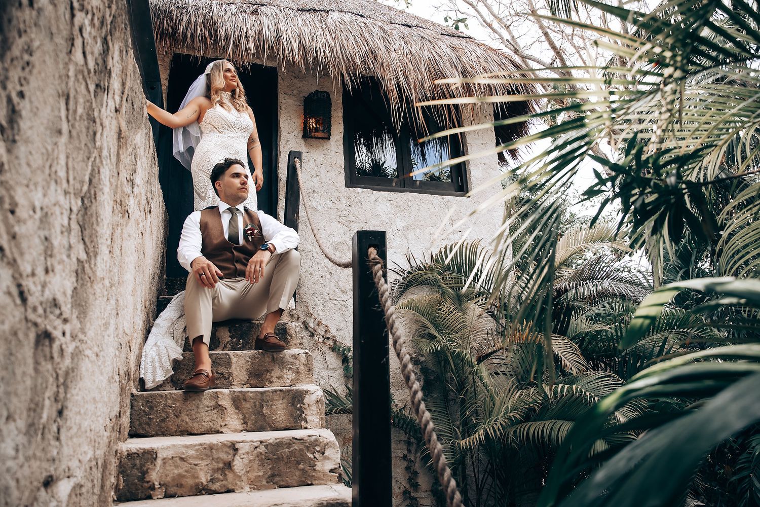 Artistic wedding photography sequence on rustic stone steps with palm fronds in the background.