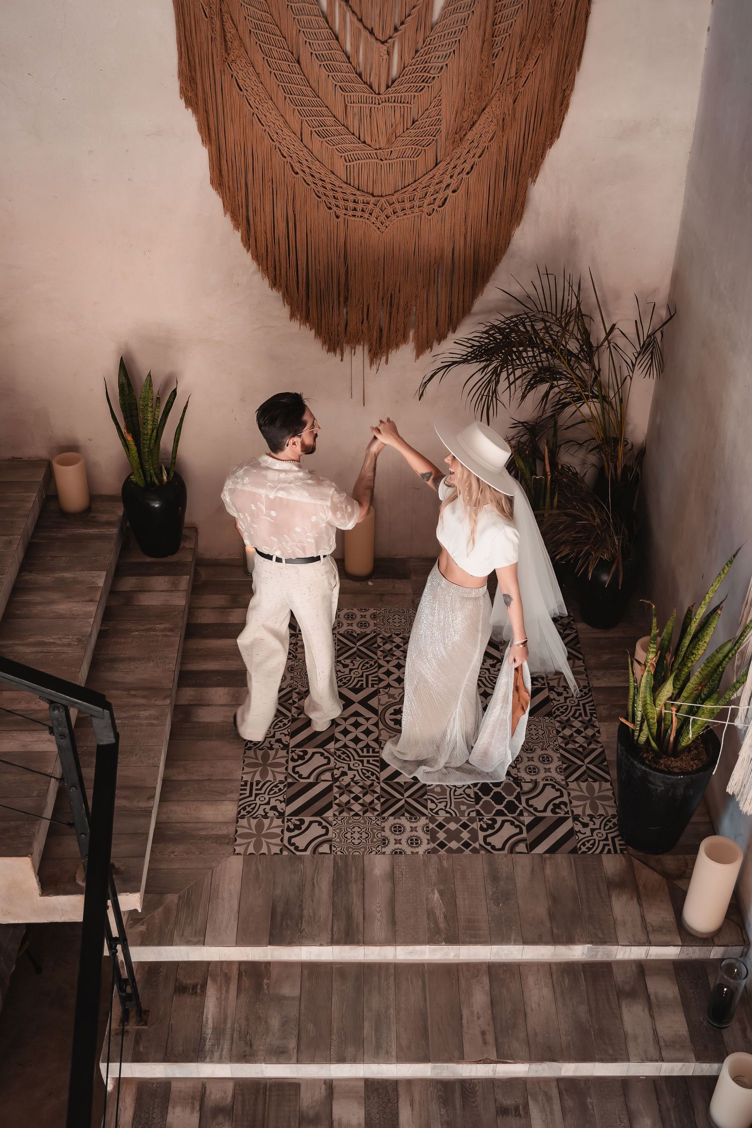 Wedding photoshoot sequence with macrame wall hanging and indoor plants on wooden floor.