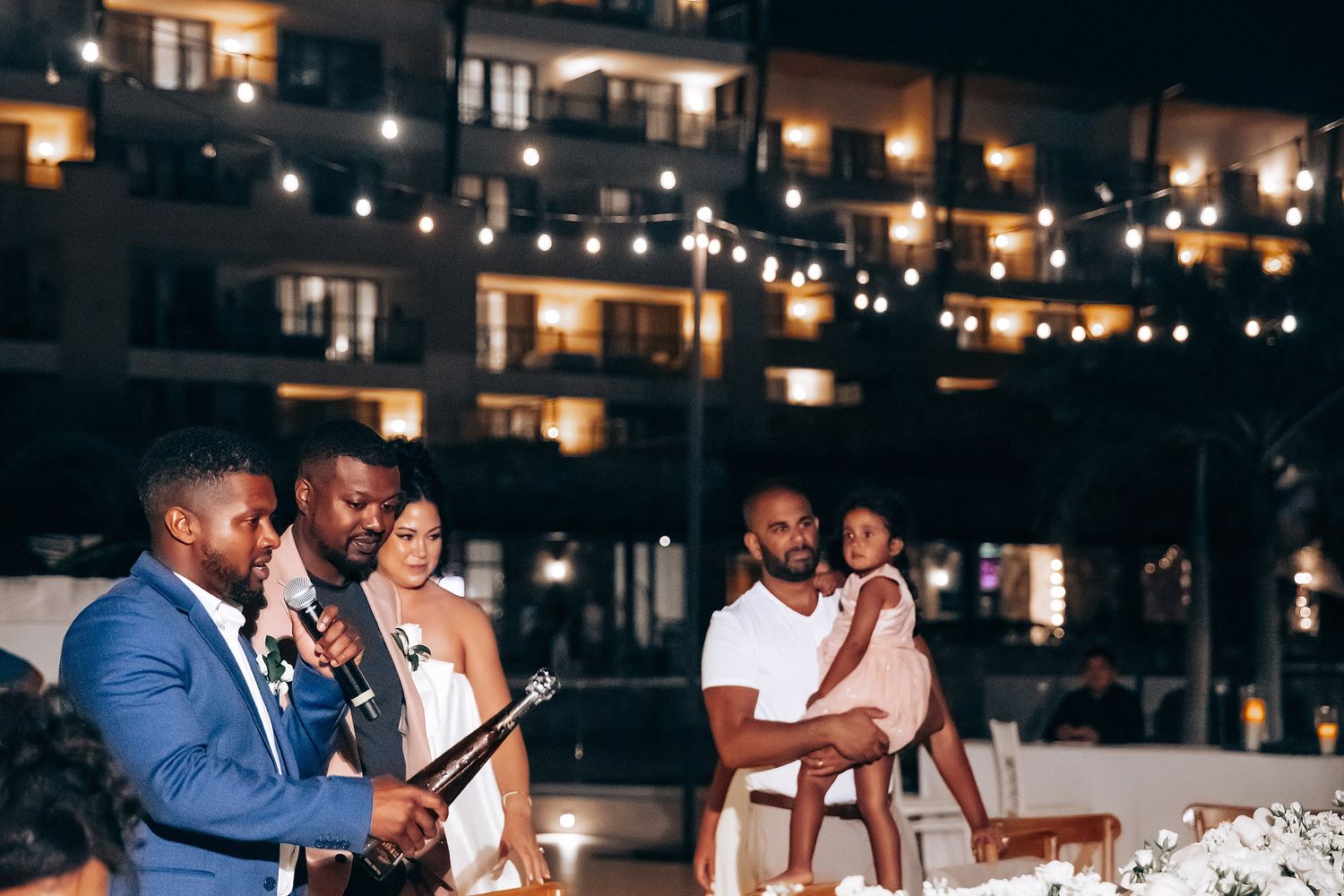 Evening reception with string lights creating a warm ambiance.