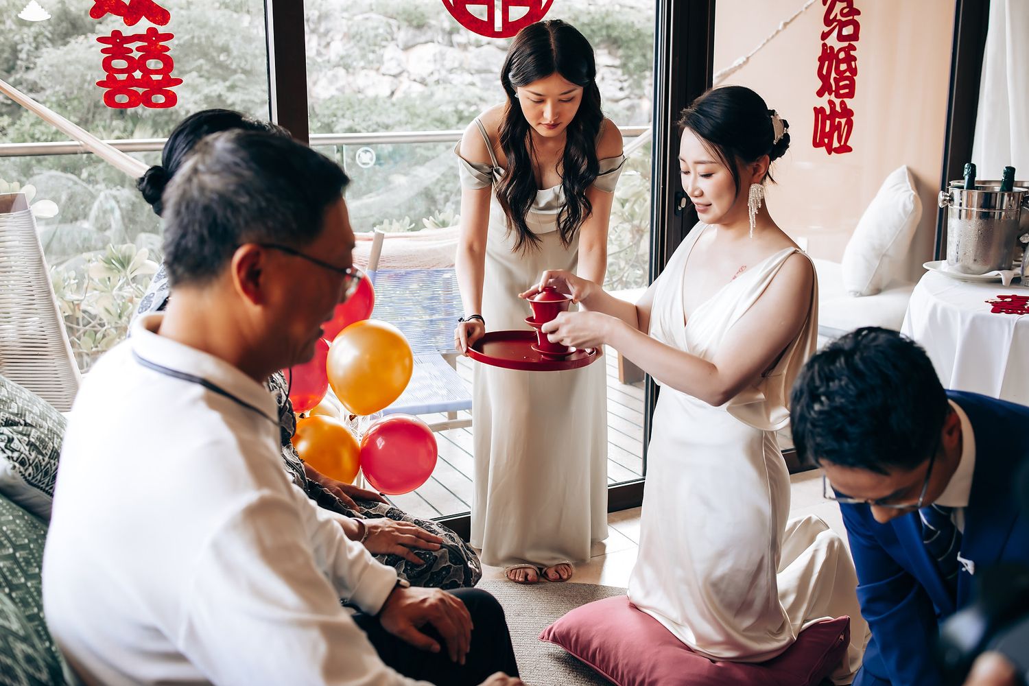 Traditional Chinese tea ceremony setup with red decorations and ornate details.