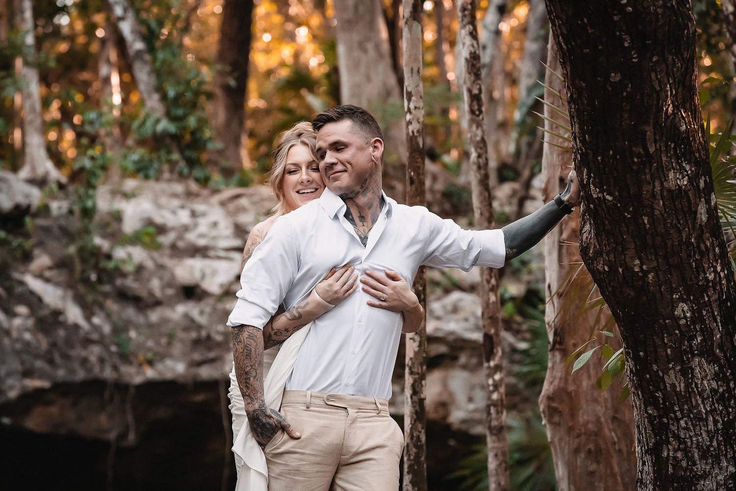 Golden sunlight filters through trees during an intimate outdoor celebration.