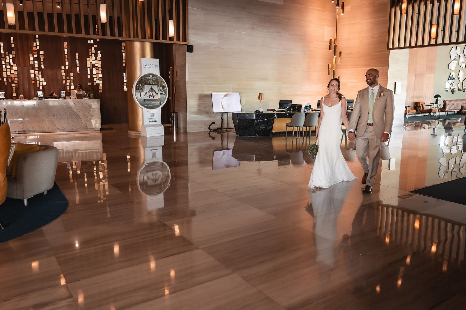 Reception venue interior with string lights and wooden beams creating a warm ambiance.
