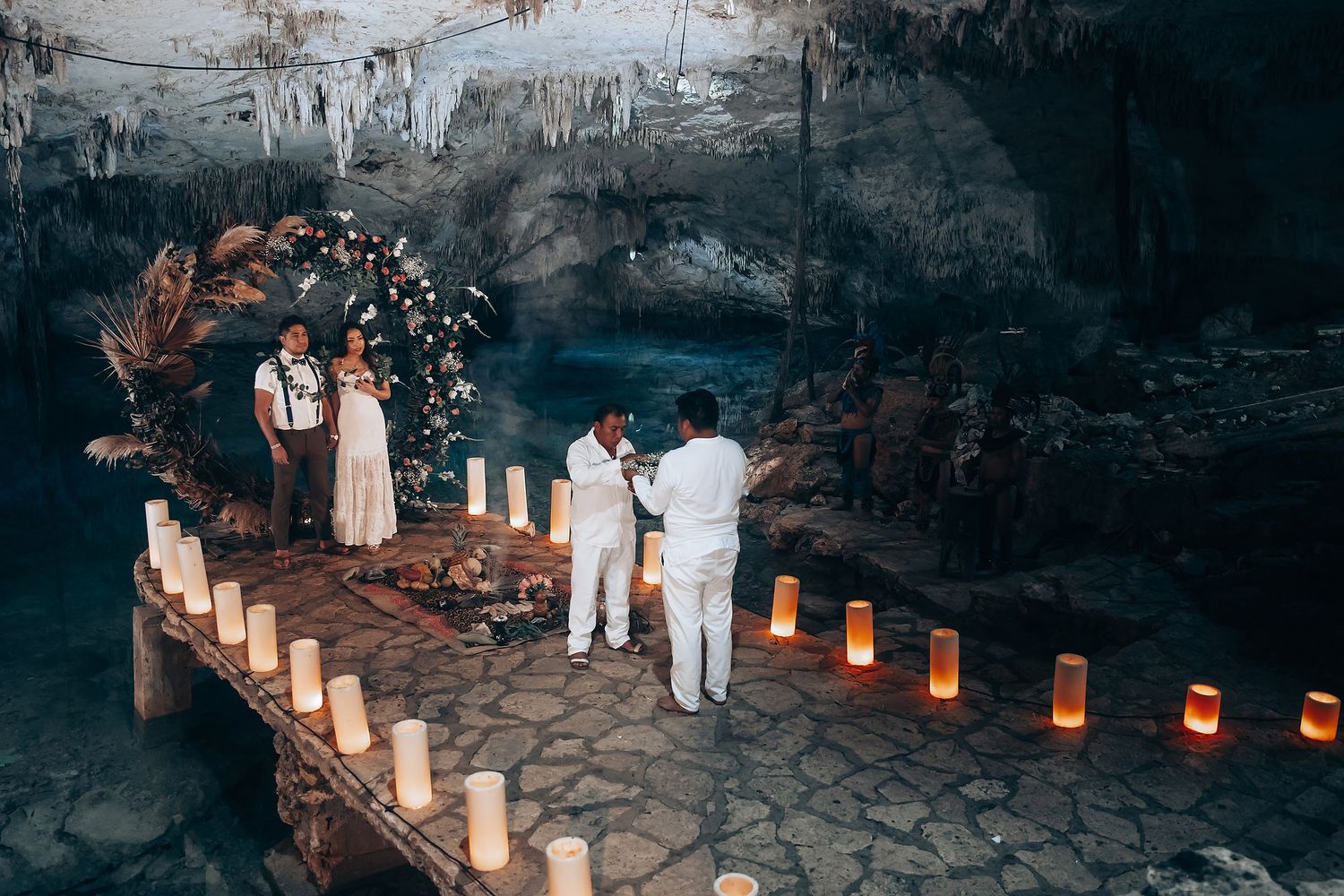 Paper lanterns illuminate a dark stone pathway at night, creating a warm and enchanting ambiance.