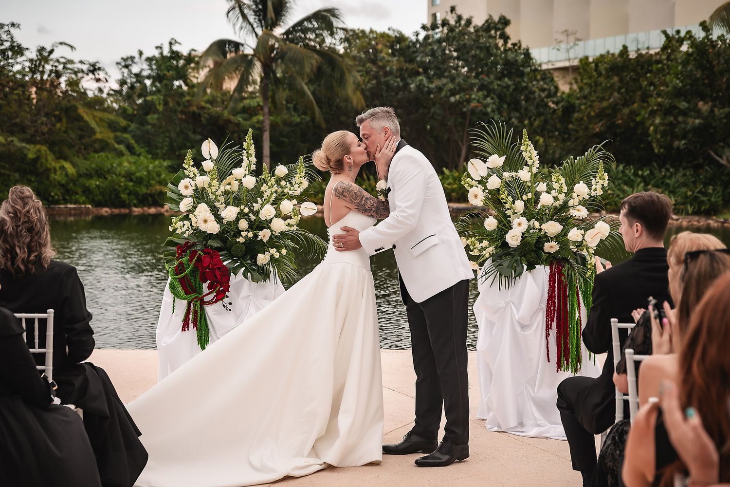 Bride and groom kiss during Grand Palladium Costa Mujeres ceremony