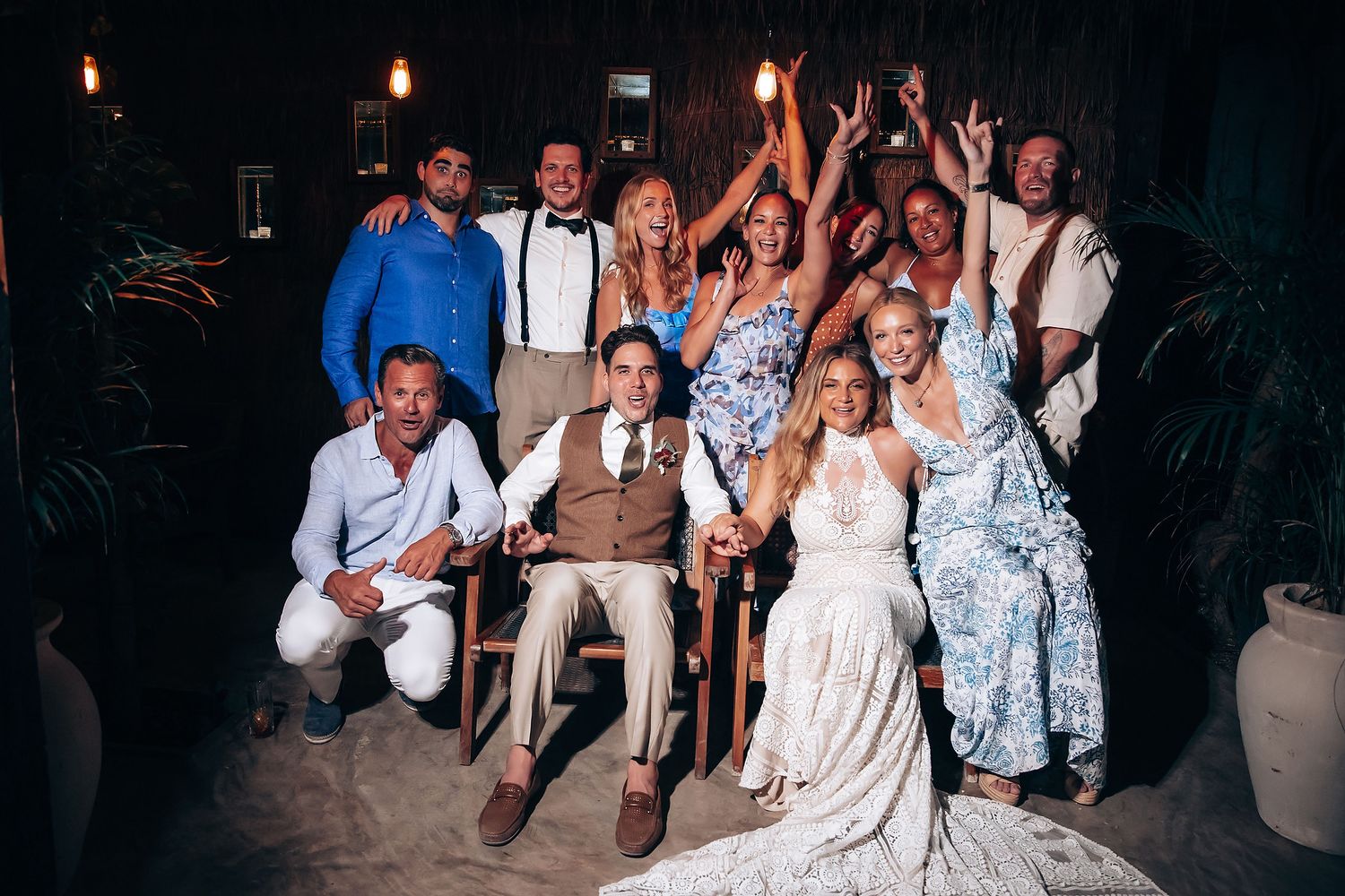 Wedding guests dance and celebrate together during a lively reception party.