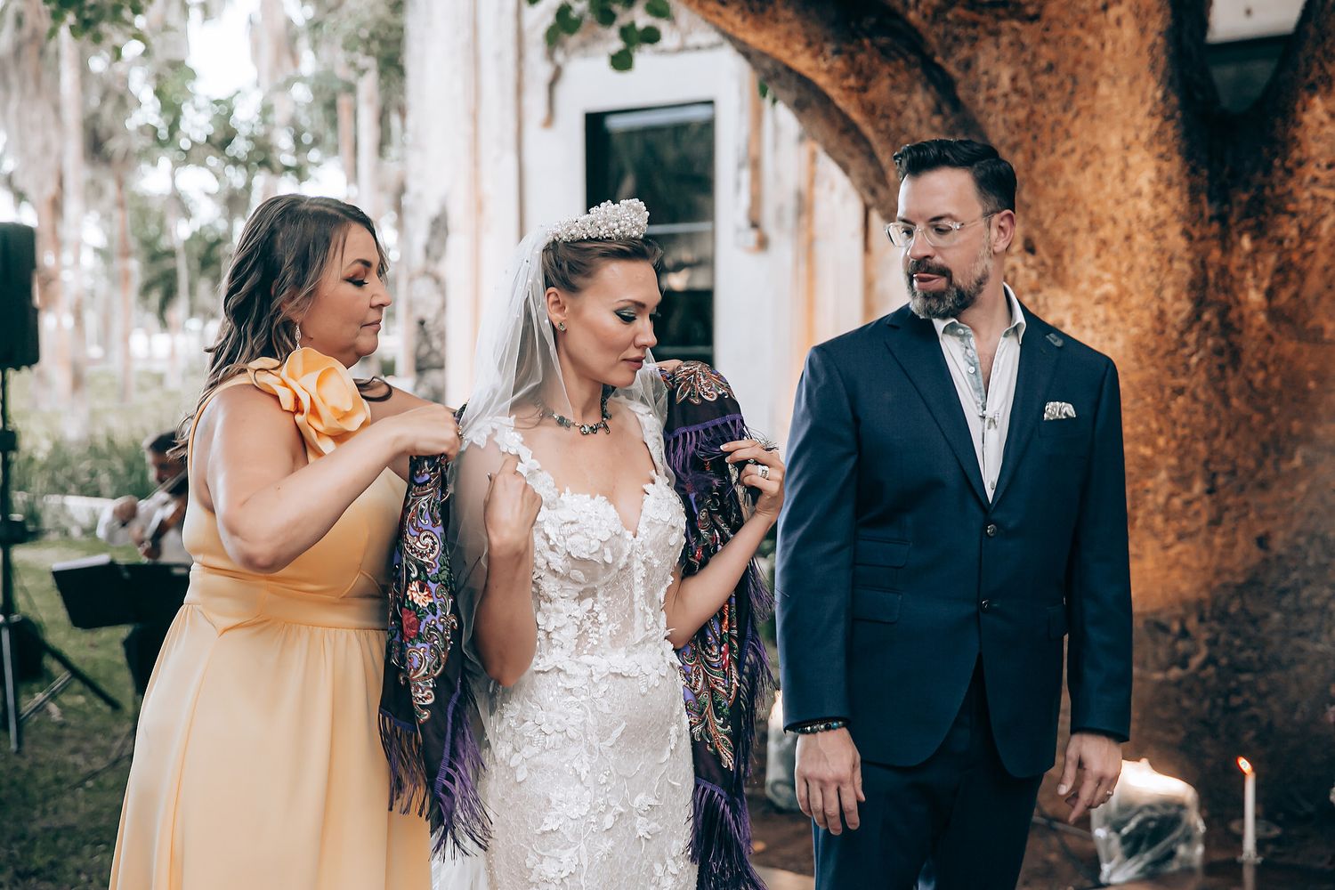 Romantic outdoor wedding photo collage showing intimate moments between couples under rustic trees and natural lighting.