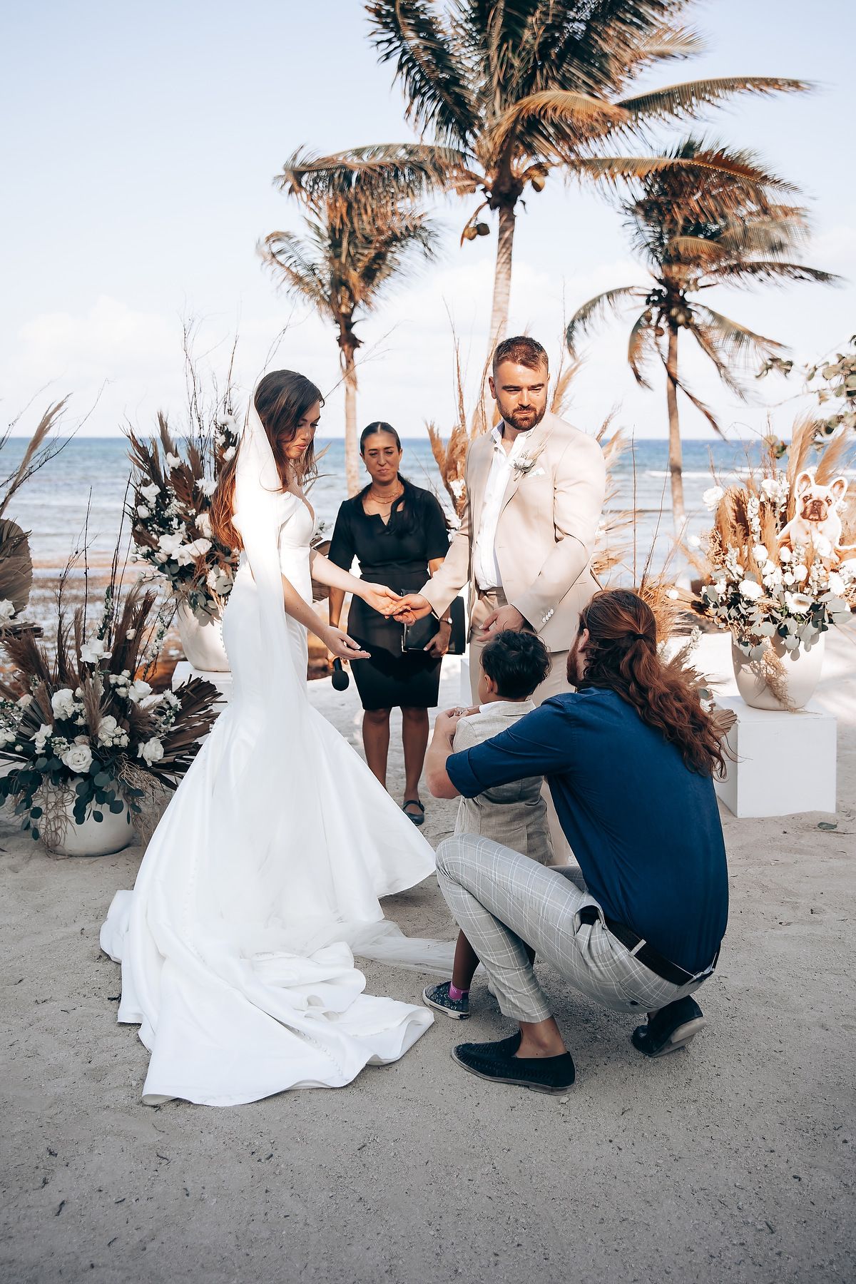 A romantic beach wedding proposal sequence shows a couple on sandy shores with palm trees swaying in the background.