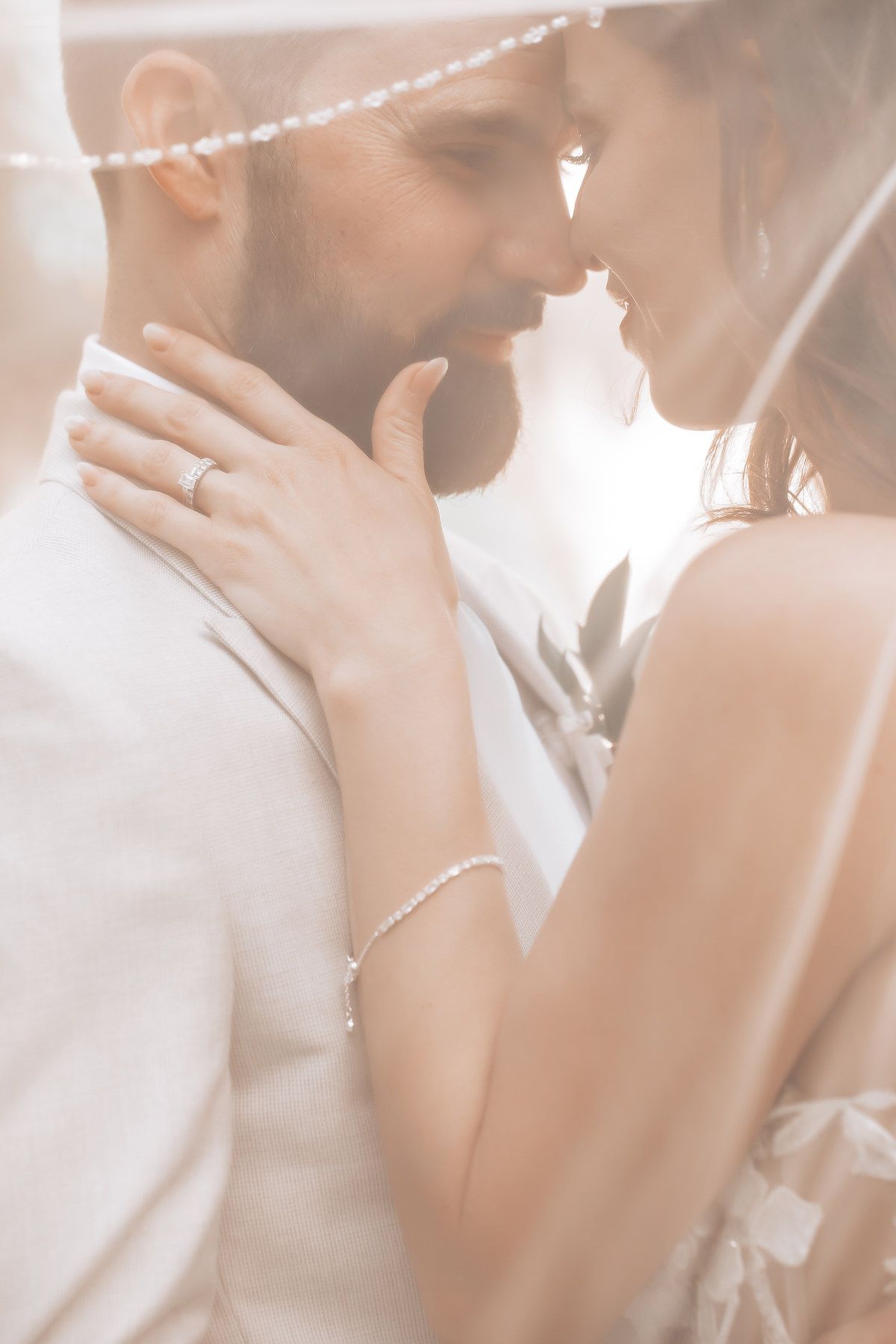 Soft-focus close-up shots of a couple sharing intimate moments in dreamy lighting.