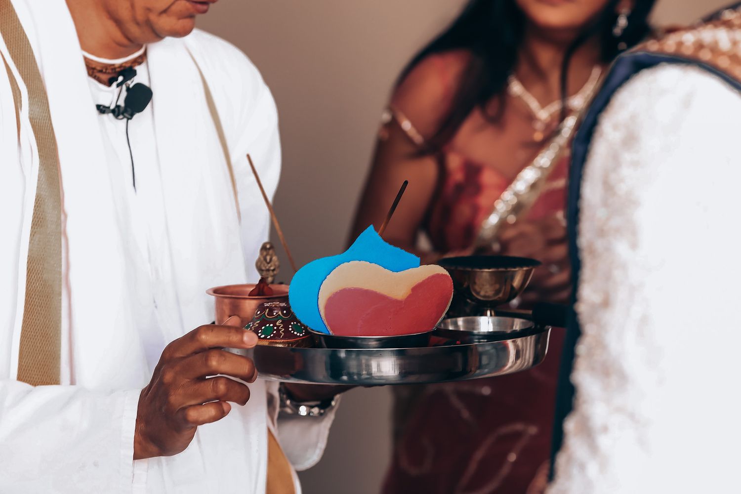 Wedding guests enjoy a buffet line serving themselves food at an elegant reception celebration.