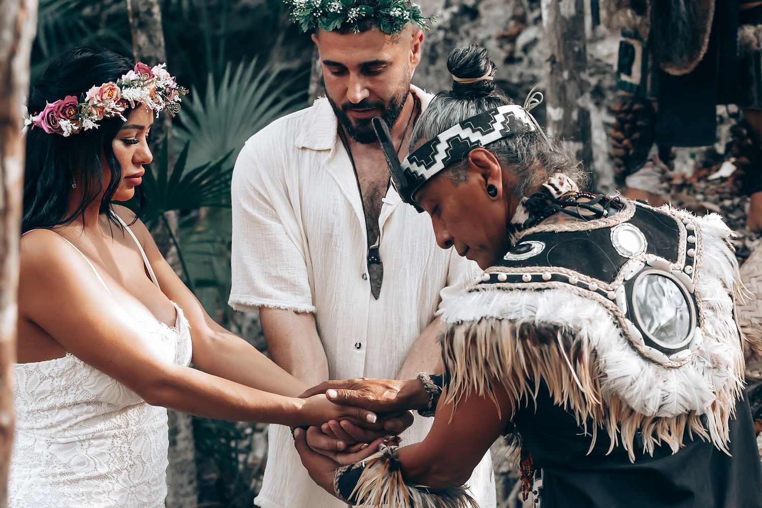 Wedding guests celebrate with joyful dancing at an outdoor reception.