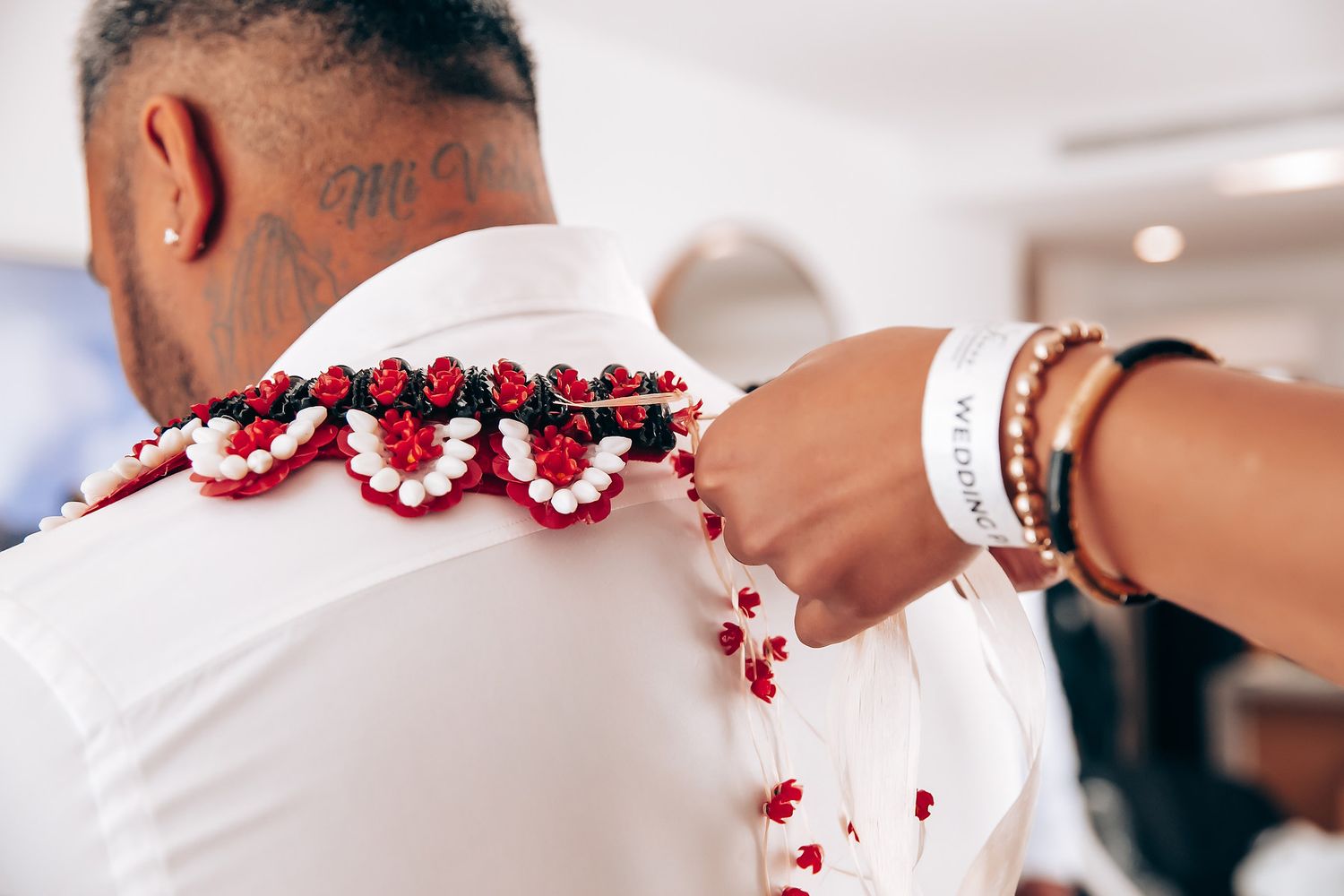 Red floral decorations and white fabric details from a wedding ceremony.