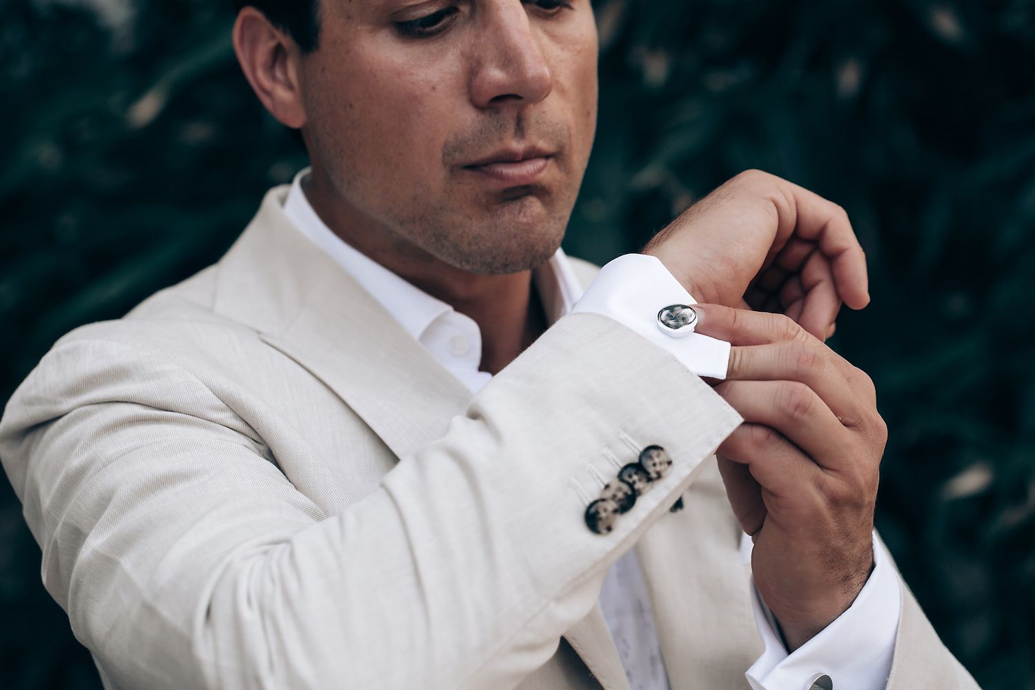A series of close-up shots showing wedding preparations in a bright white setting.