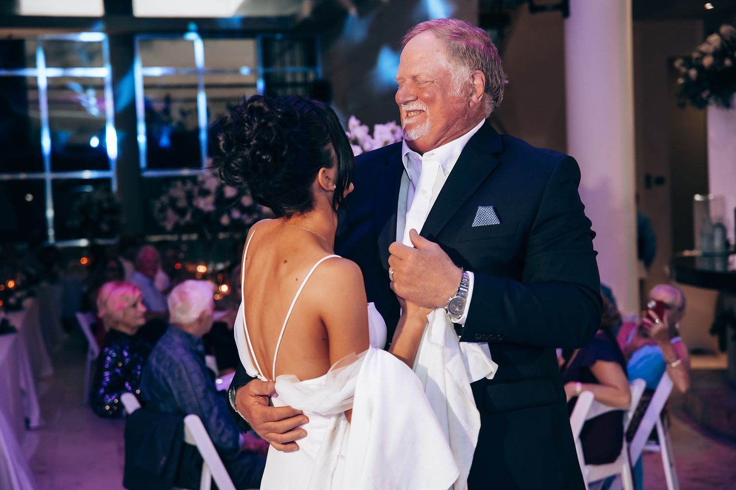A couple sharing a dance moment at their wedding reception.