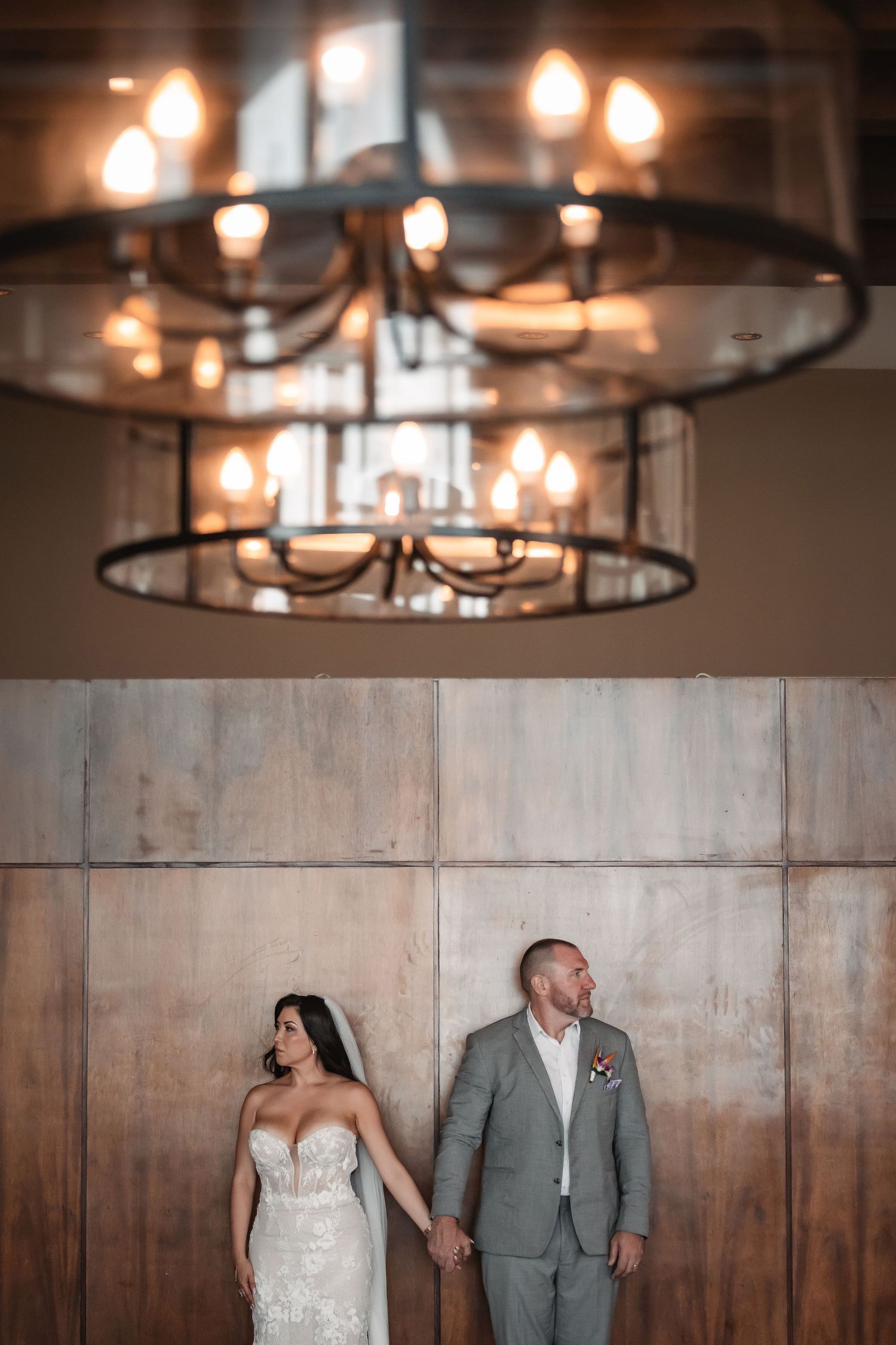 Modern pendant lighting fixtures hang from the ceiling in a stylish venue space.