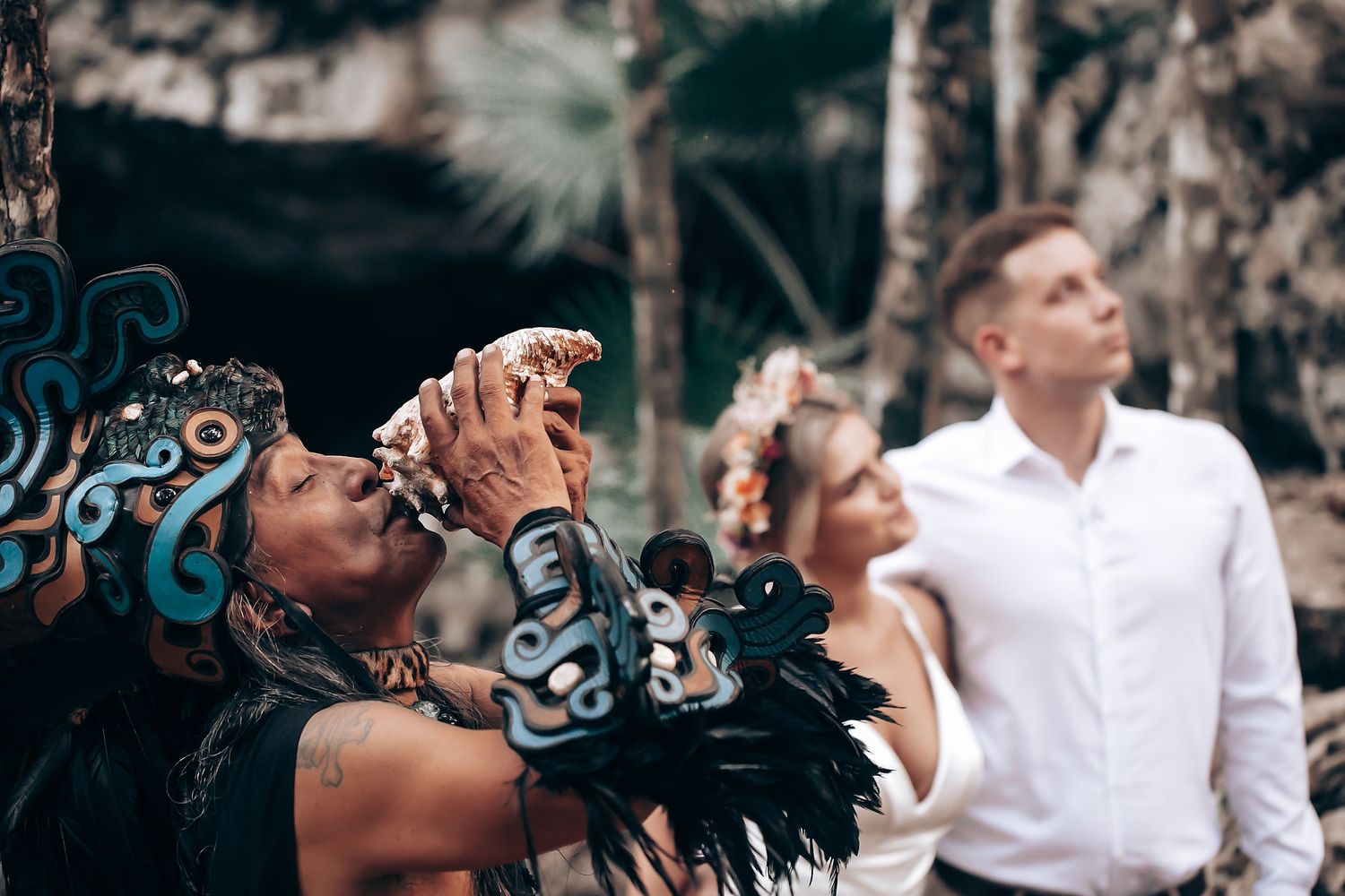 People sharing an emotional moment together in a natural forest setting.
