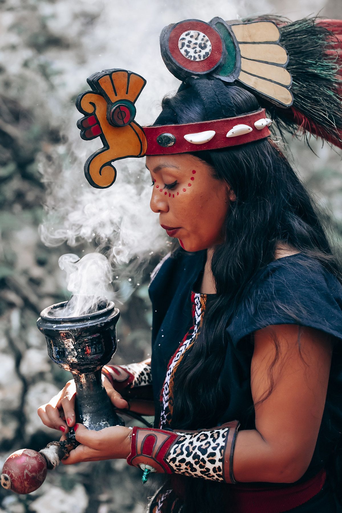 A series of photos showing a traditional Native American smudging ceremony with smoke rising from a ceremonial vessel.