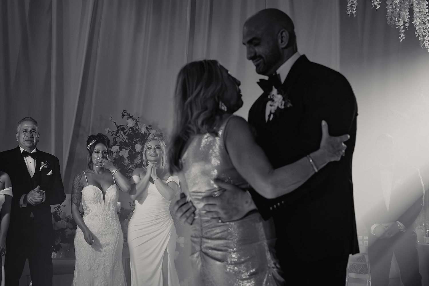Black and white photo series showing couples dancing together at a formal wedding reception celebration.