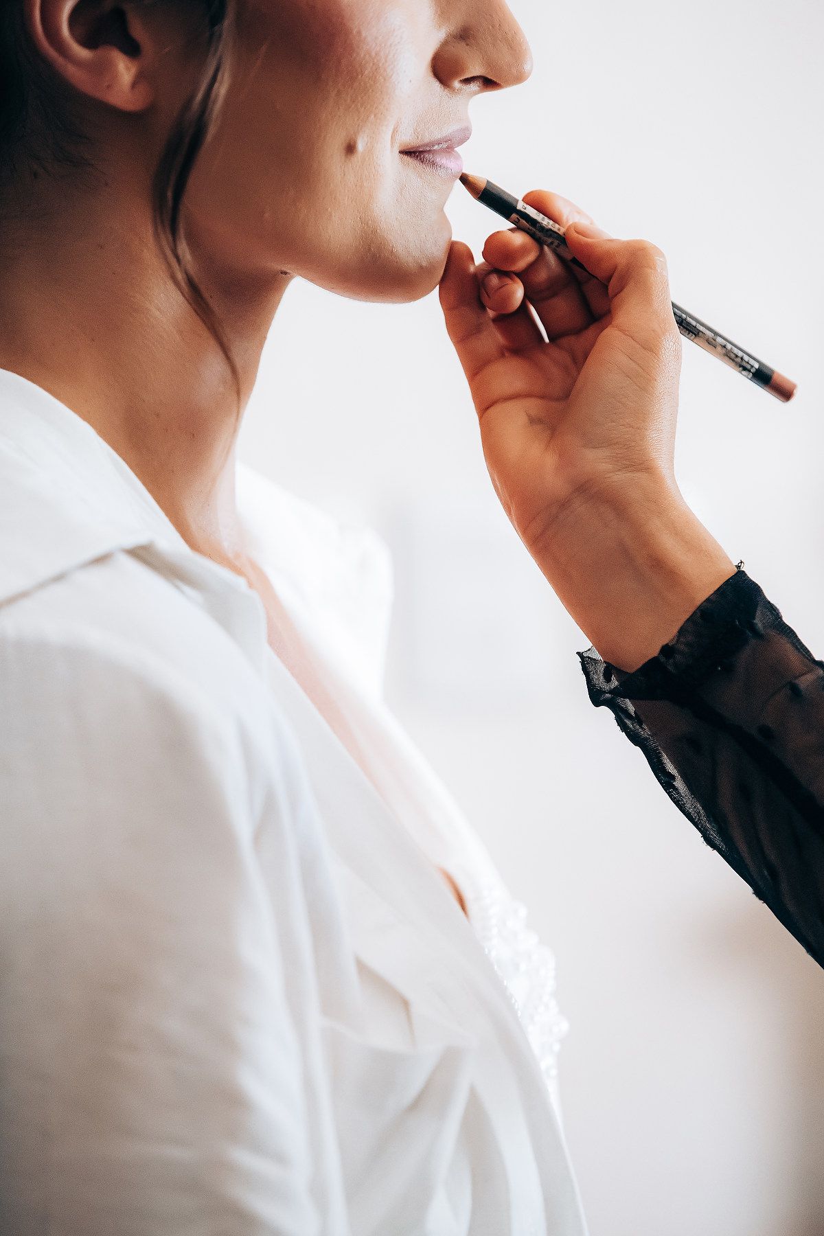 A series of profile shots showing someone in a white shirt smoking an electronic cigarette or vape device.