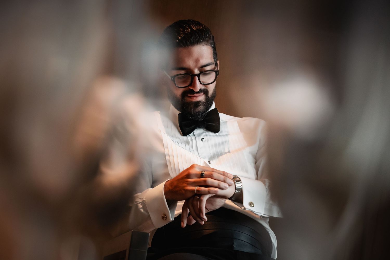 Wedding preparation moments showing details of formal attire and accessories.