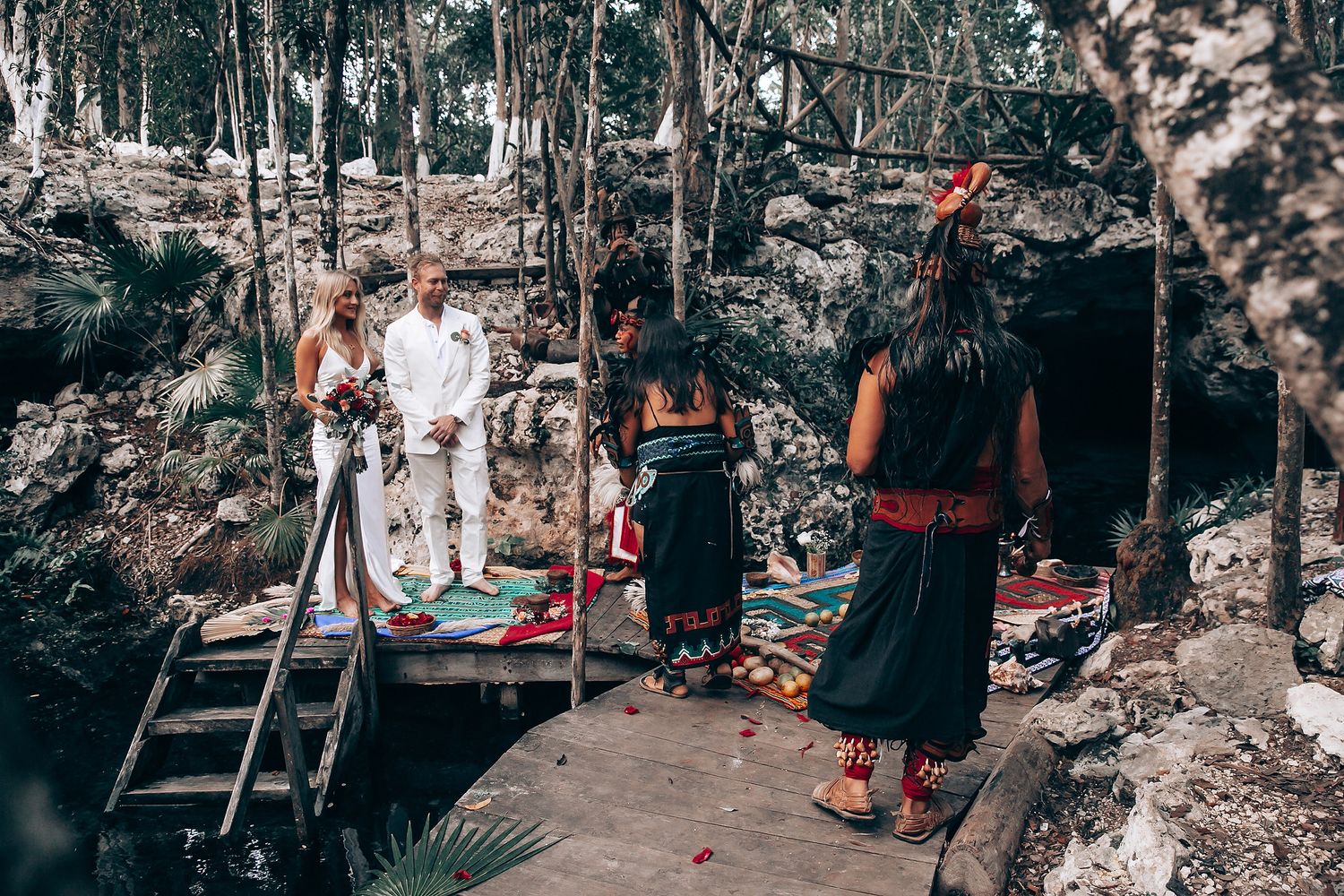 A traditional Mayan ceremony takes place in a lush forest setting with colorful textiles and ritual elements.