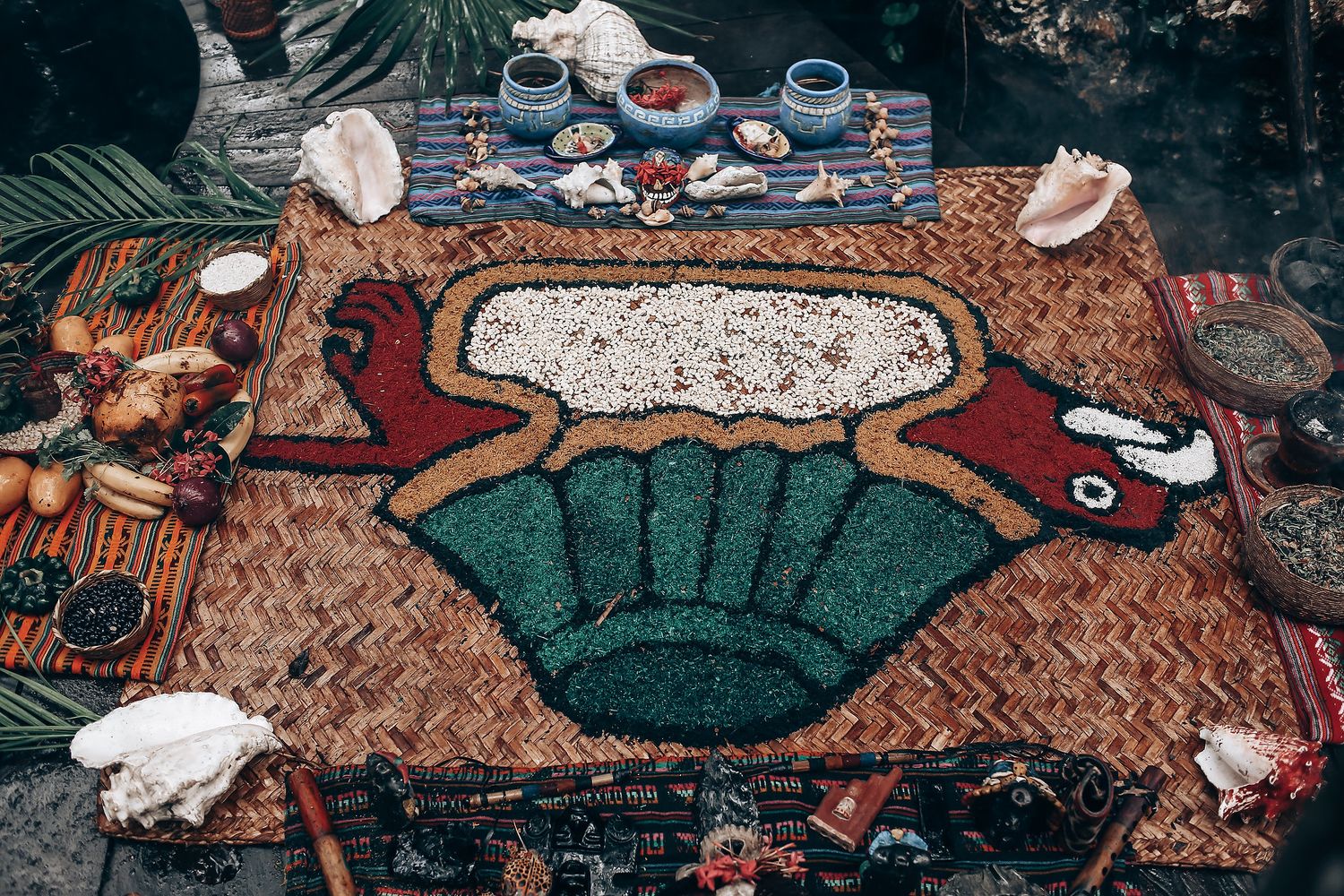 Ancient Japanese artwork depicting figures reclining on decorative mats and cushions in a traditional interior scene.