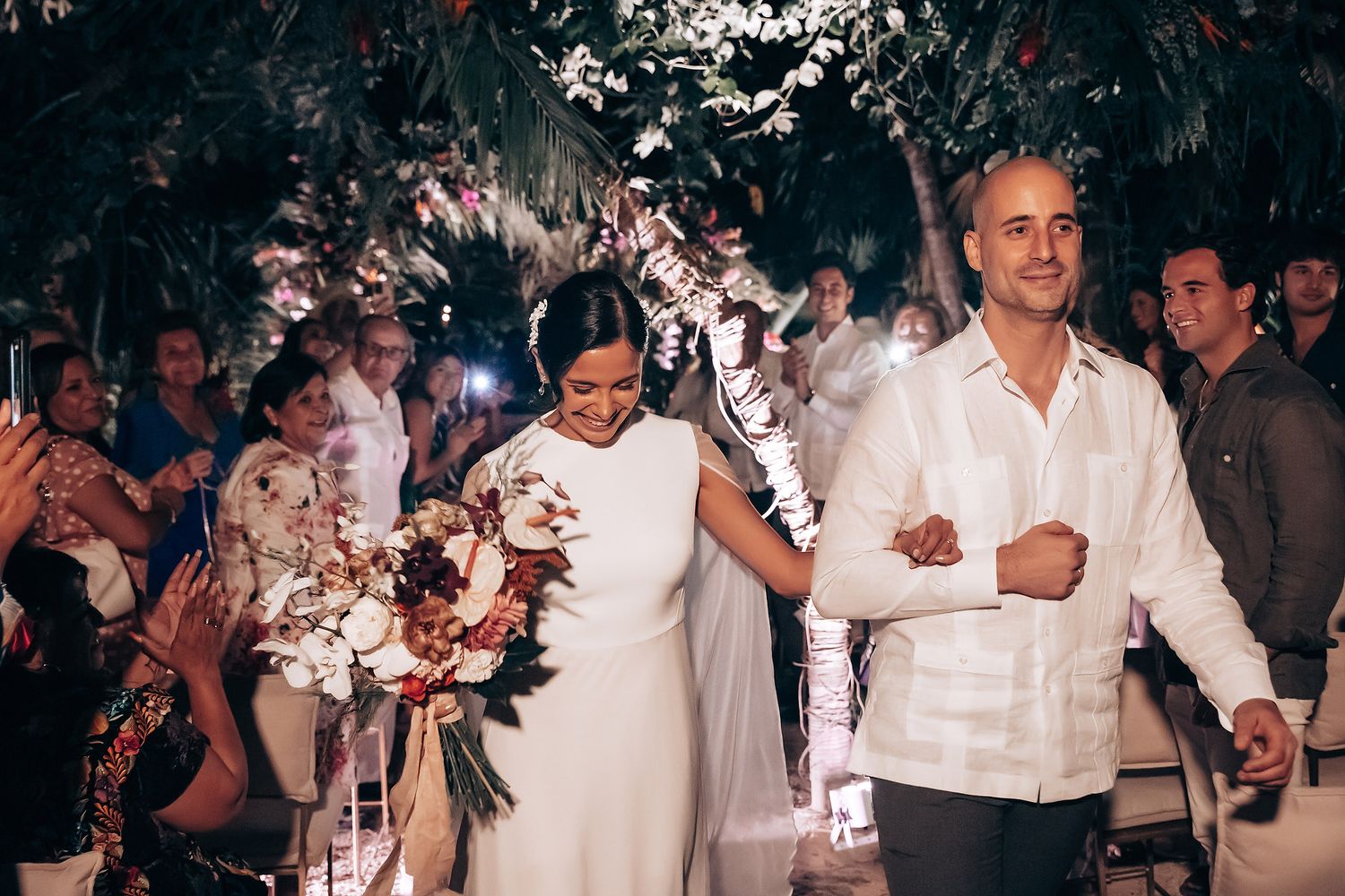 Wedding celebration with guests dancing and enjoying the evening festivities.