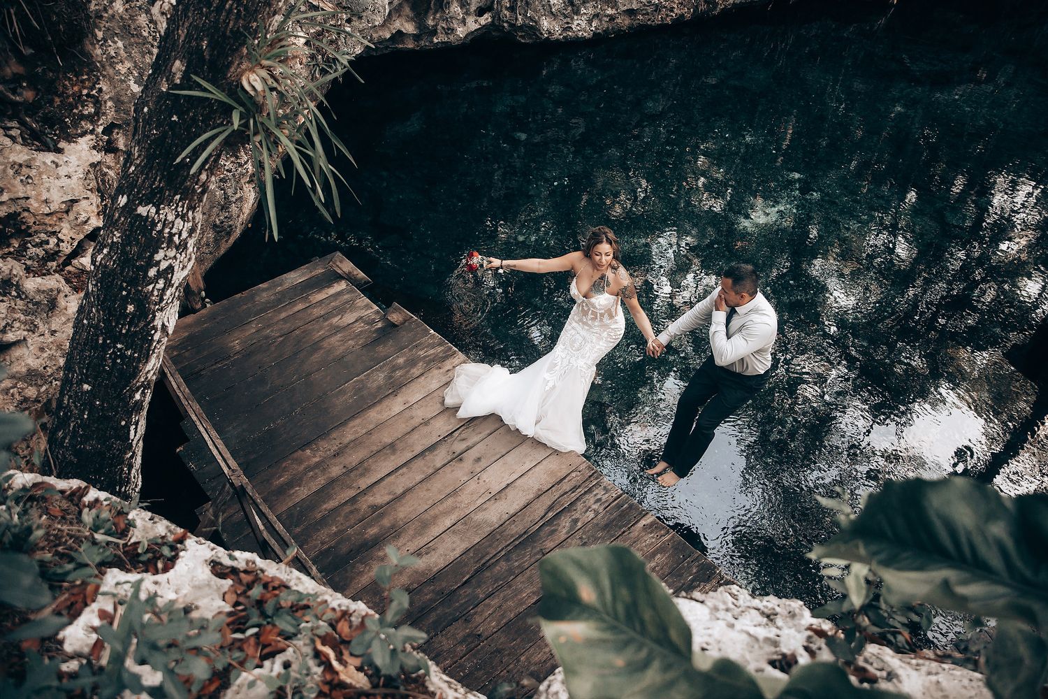 Wedding celebration in a rustic wooden venue with natural light filtering through.