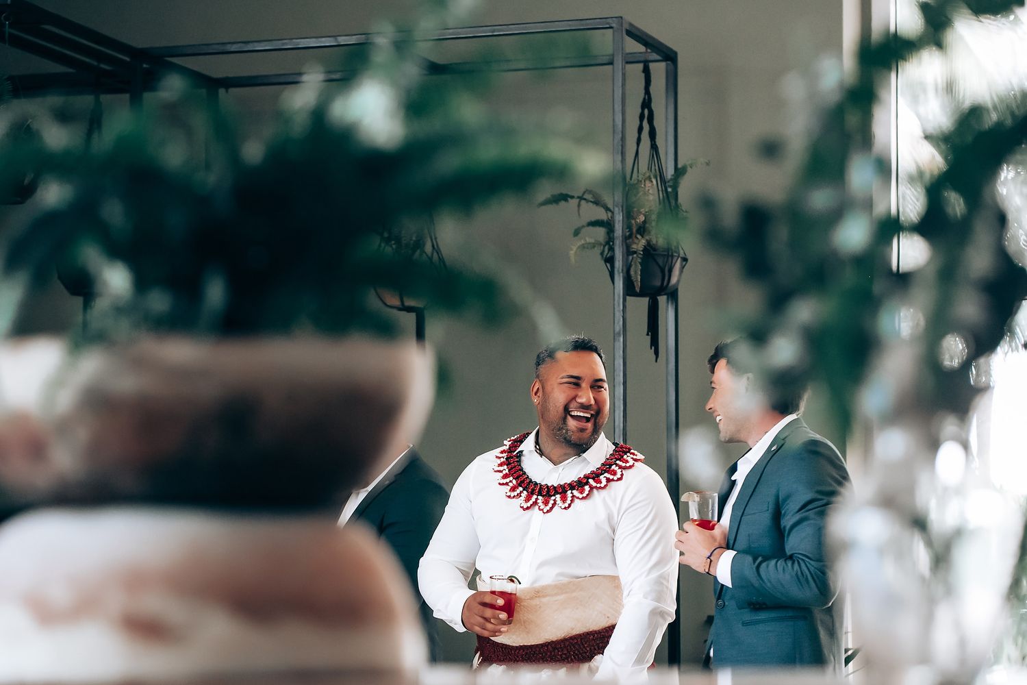 Blurred outdoor wedding ceremony scene with natural lighting.