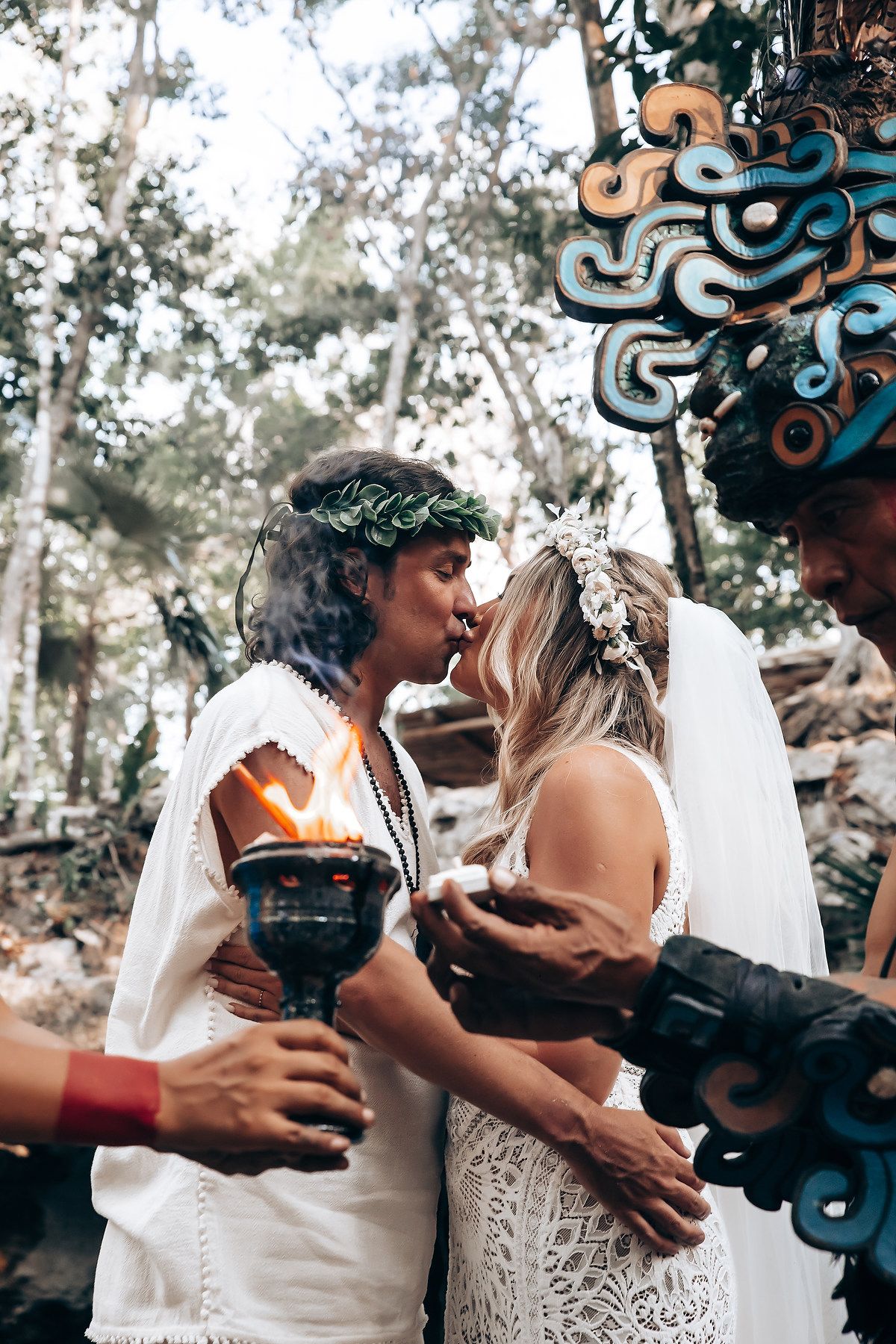 Three sequential photos show a couple in wedding attire sharing intimate moments in an outdoor wooded setting.
