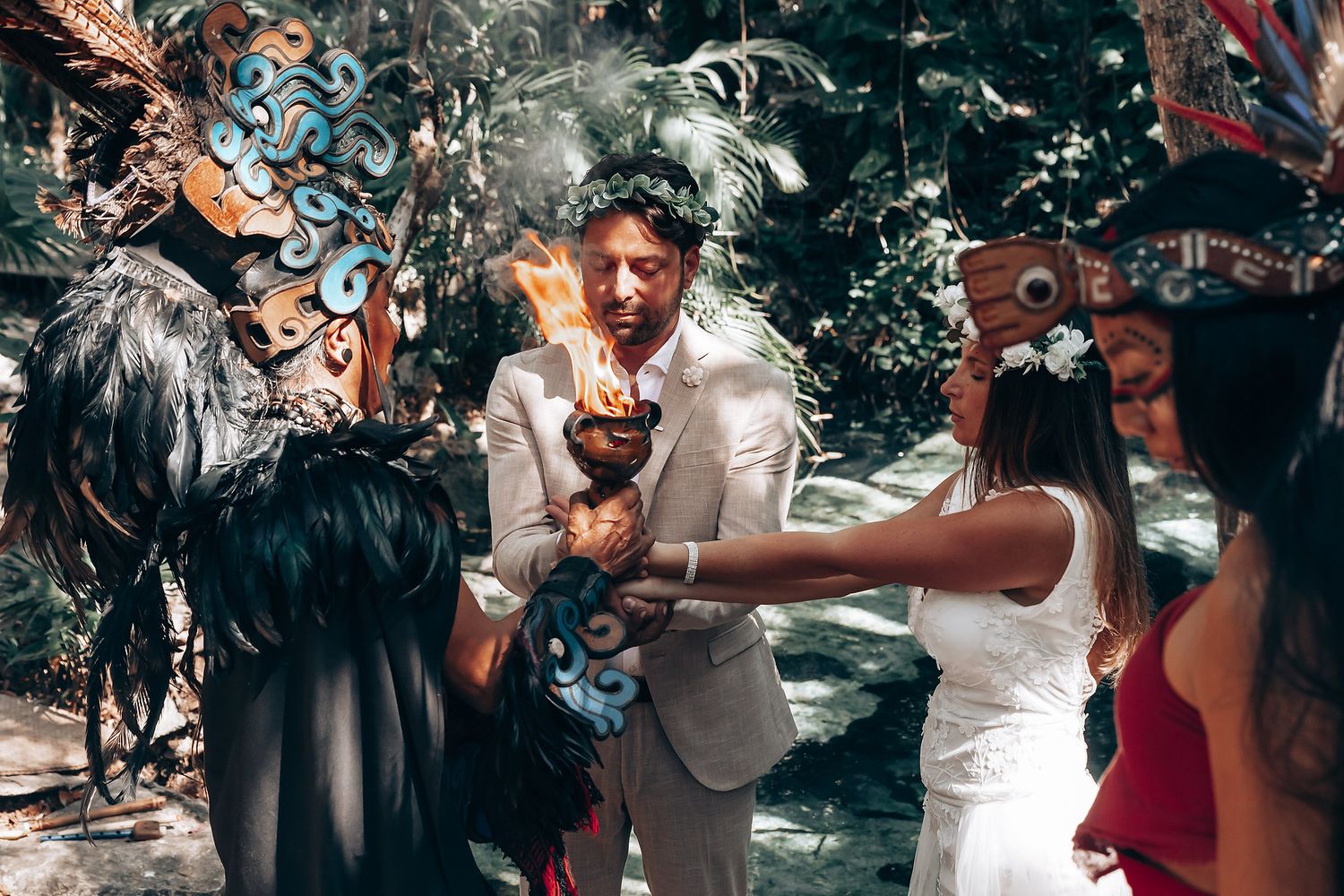 Intimate spiritual ceremony with traditional Mayan elements in natural setting.