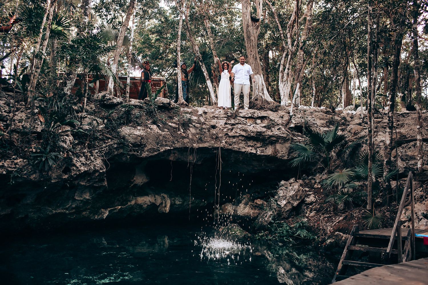 Scenic forest wedding venue with tall trees creating a natural backdrop.