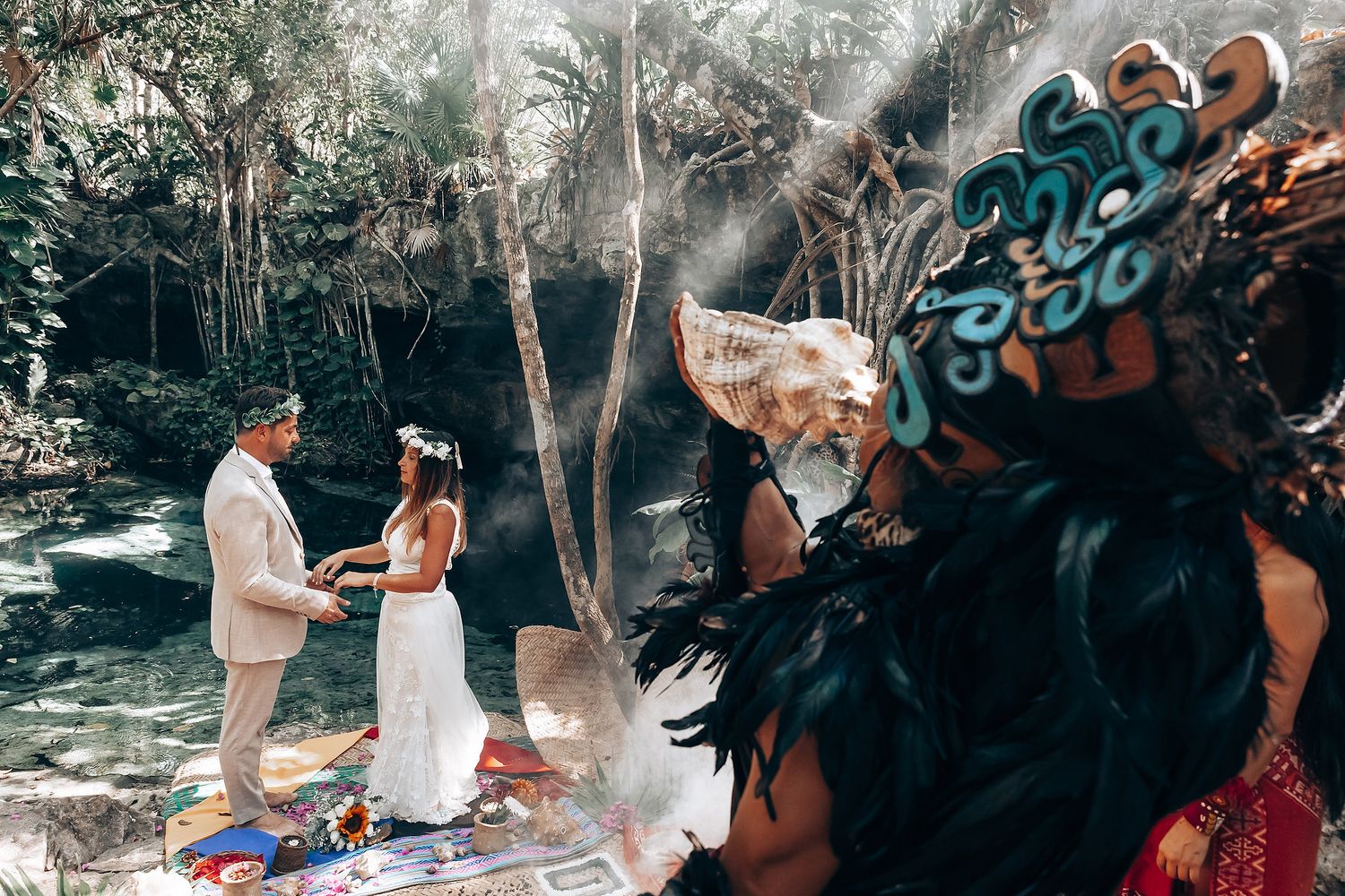 A magical outdoor ceremony setup in a lush tropical forest with decorative elements and natural lighting.