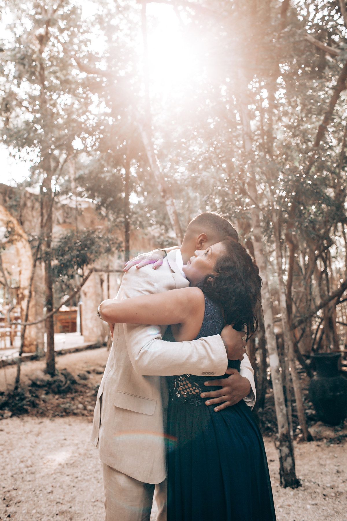 A romantic outdoor photo sequence shows an intimate embrace between two people in a wooded setting with soft lighting.