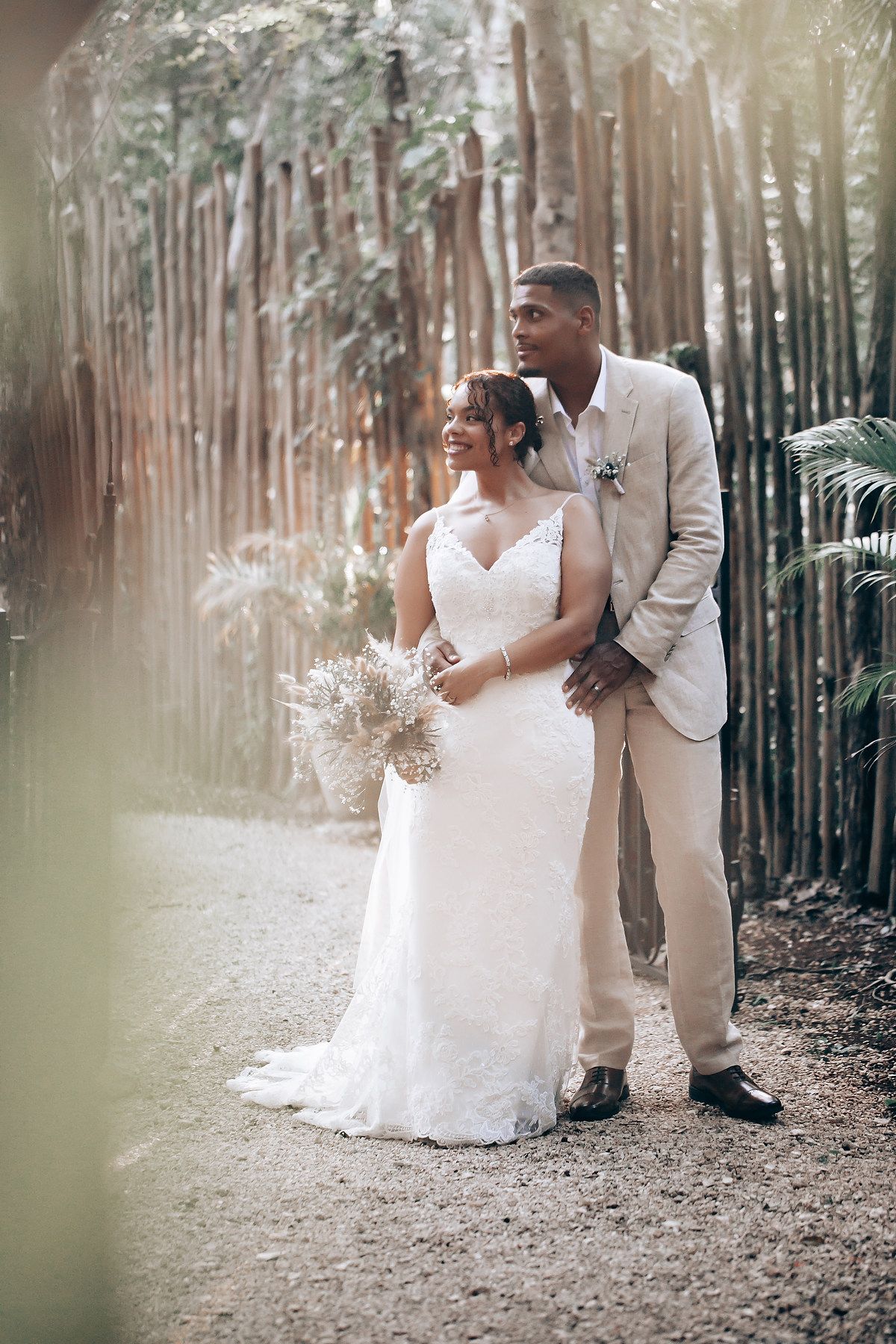 Romantic wedding photos taken in a pine forest with soft natural lighting filtering through the trees.